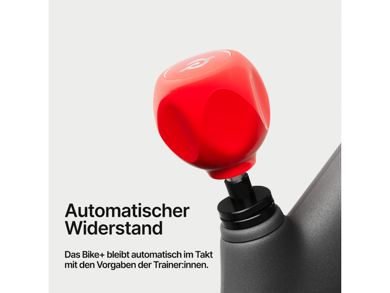 Ein roter würfelförmiger Drehknopf an einem schwarzen Gerät. Weißer Text lautet 'Automatischer Widerstand' und beschreibt die Funktion des Fahrrads.