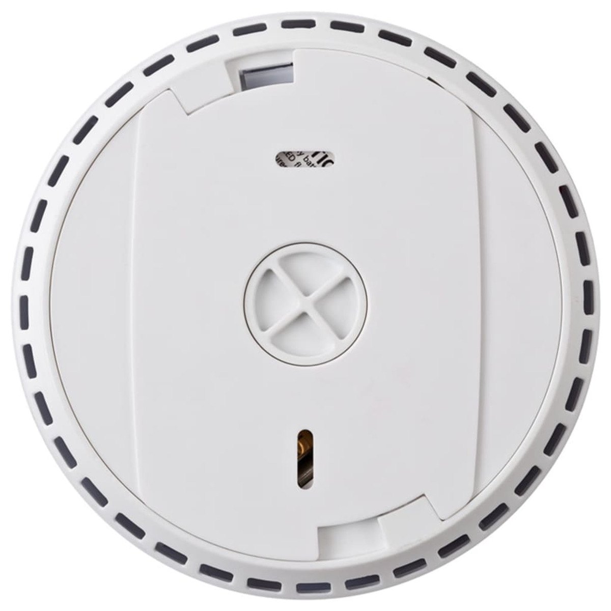 Vista superior de un detector de humo blanco. Tiene forma circular con un panel central, un detalle en forma de cruz y un borde punteado negro.