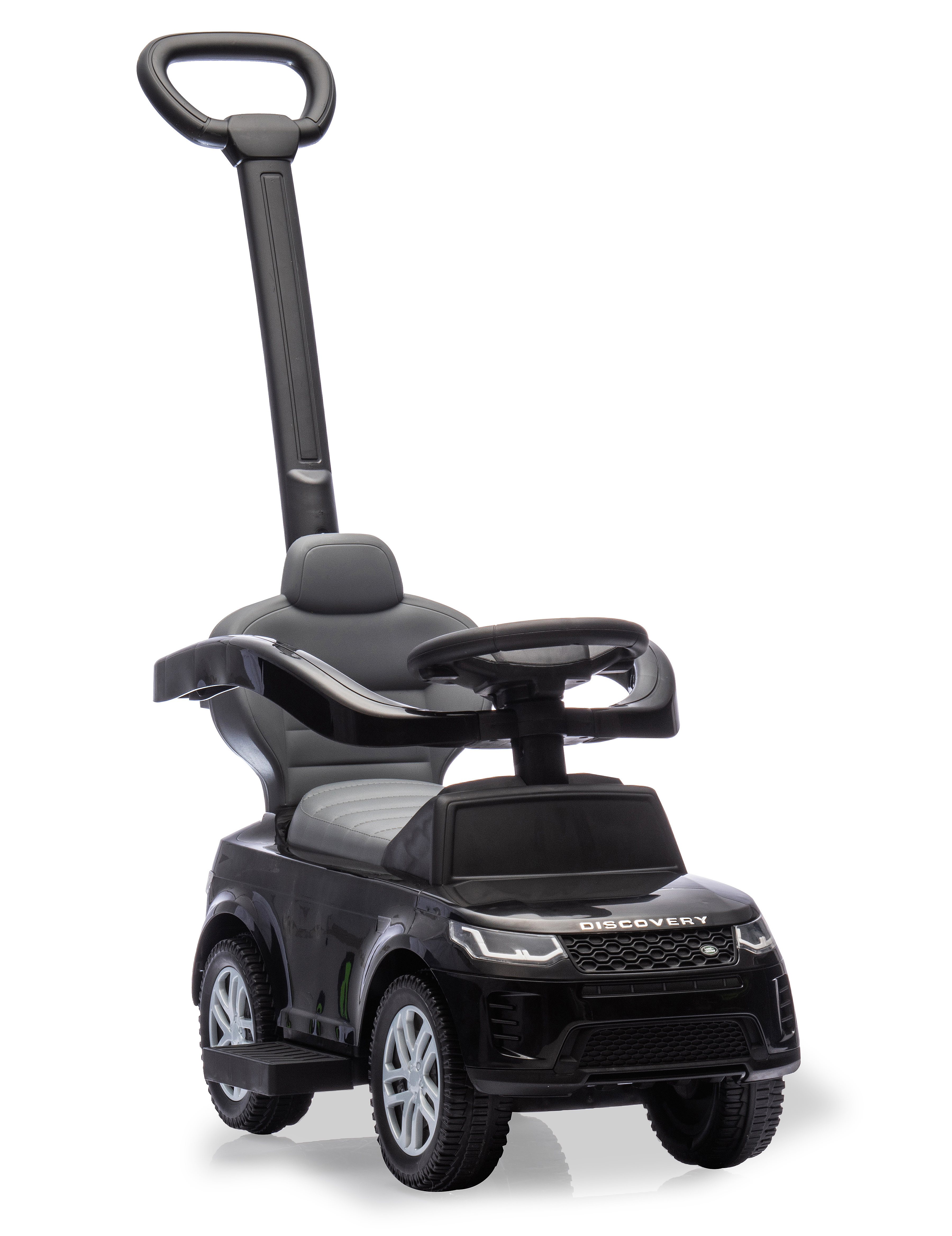 Ein schwarzes Spielzeugauto mit Griff. Es hat das Wort "DISCOVERY" auf der Vorderseite. Die Räder sind weiß und schwarz.