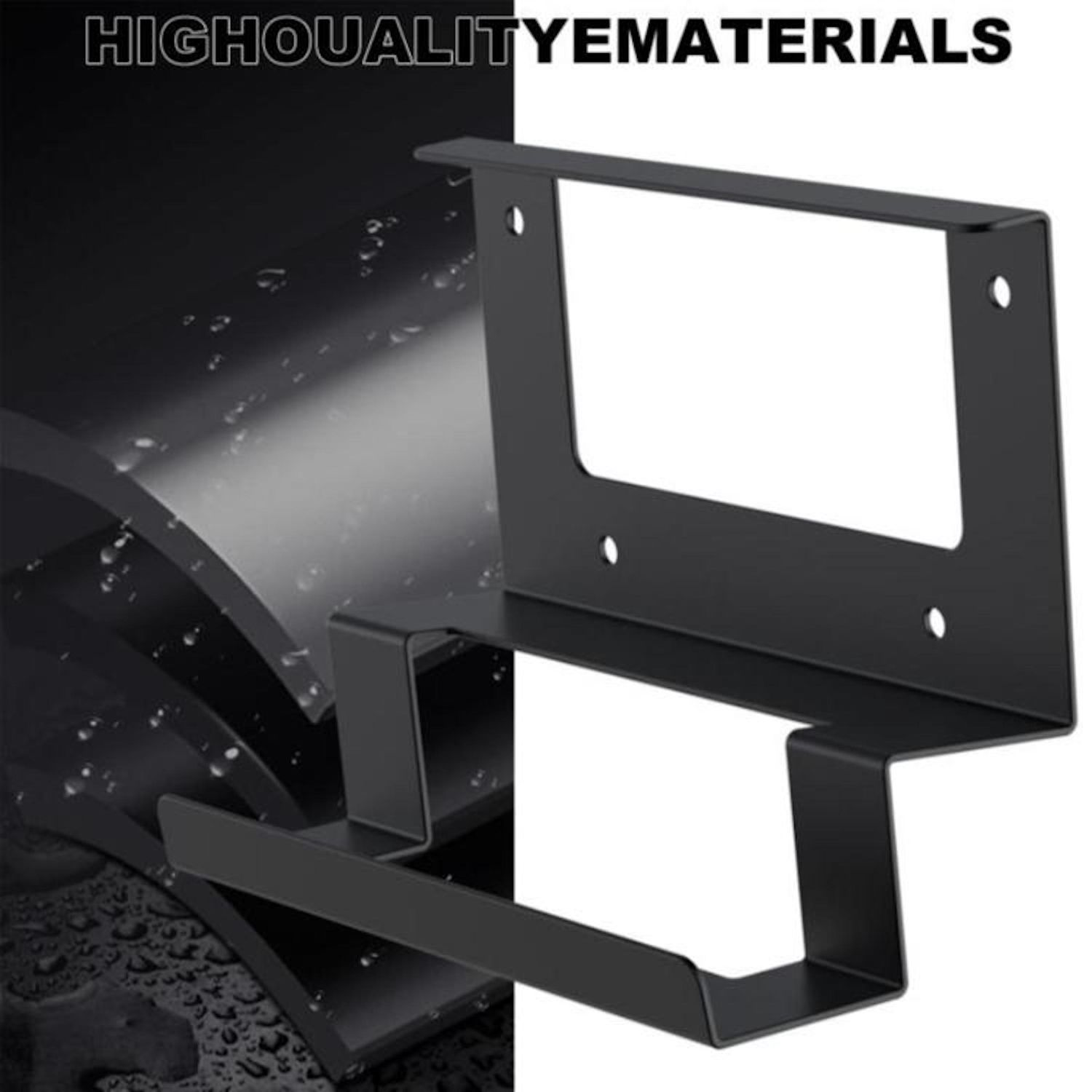 Eine schwarze Metallhalterung zur Montage. Sie hat einen rechteckigen Rahmen mit Löchern und eine untere regalartige Struktur.