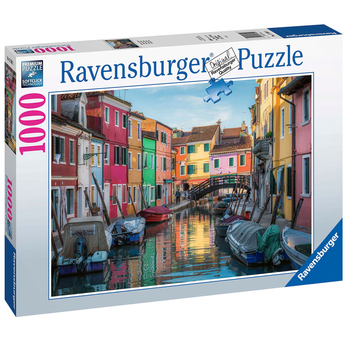 Una caja de rompecabezas muestra casas coloridas a lo largo de un canal con botes. La escena se refleja en el agua. Un puente es visible.