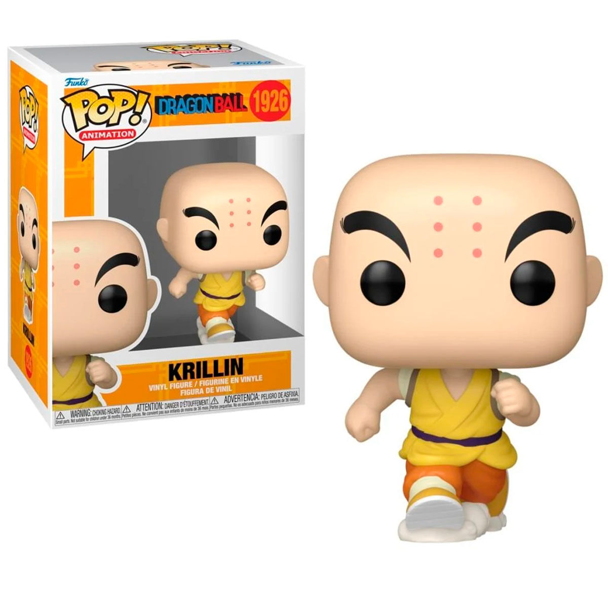 Figurka Krillin Funko Pop stoi obok swojego pudełka. Figurka jest łysa, nosi żółto-pomarańczowy strój i ma sześć kropek na czole.