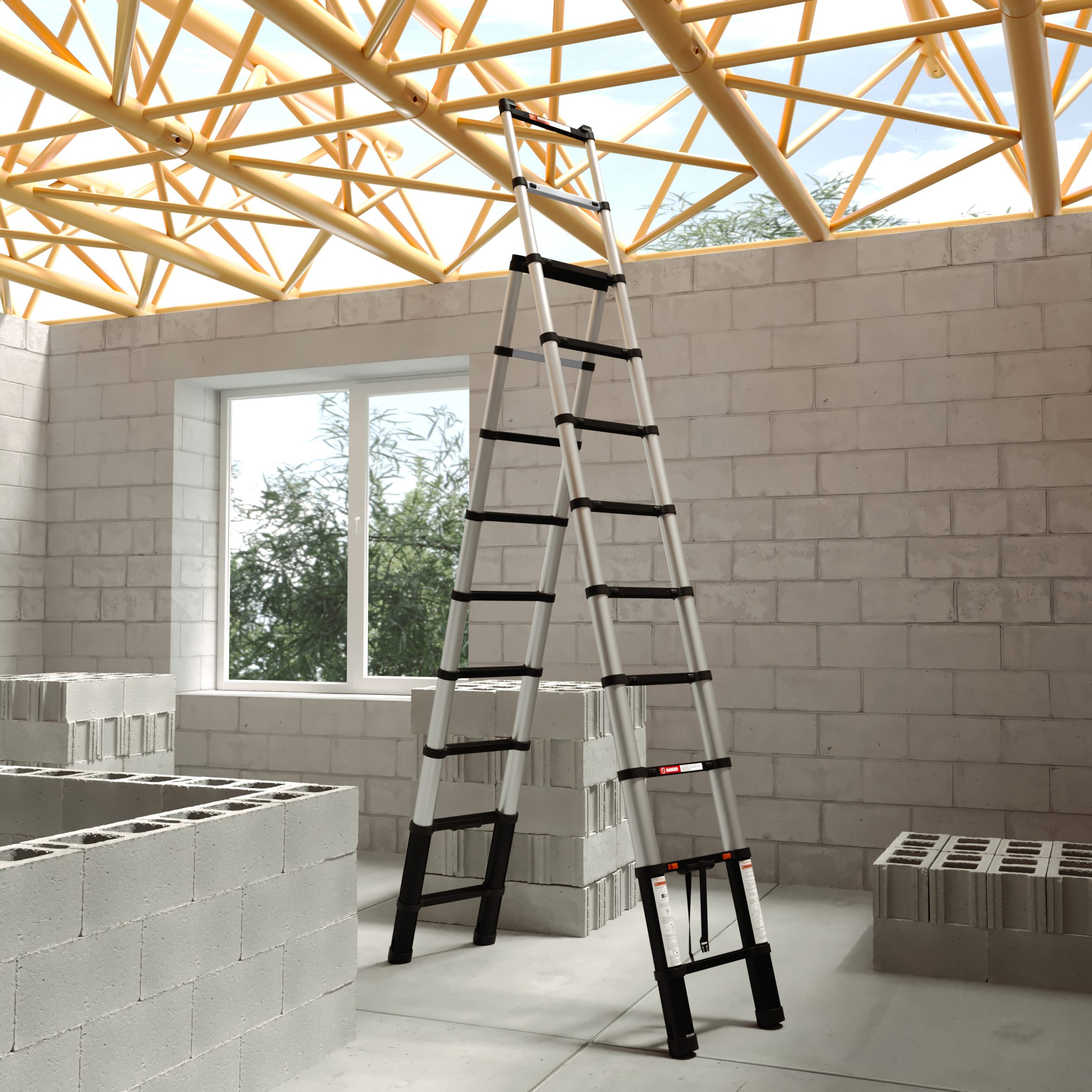 A silver ladder stands in a room under construction. Concrete blocks form the walls and floor. A wooden frame roof is visible.