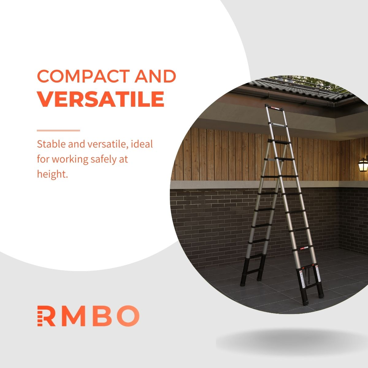 A silver and black telescopic ladder is set up under a roof. The background features wooden paneling, a brick wall, and a light.