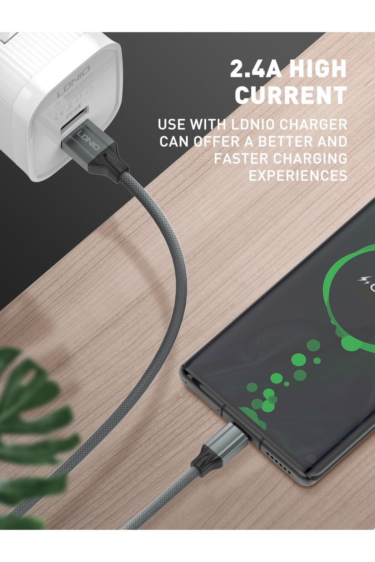 Bir telefon, bir şarj cihazına bağlı gri bir kablo aracılığıyla şarj oluyor. Metin '2.4A HIGH CURRENT' ve 'FASTER CHARGING EXPERIENCES' şeklinde.