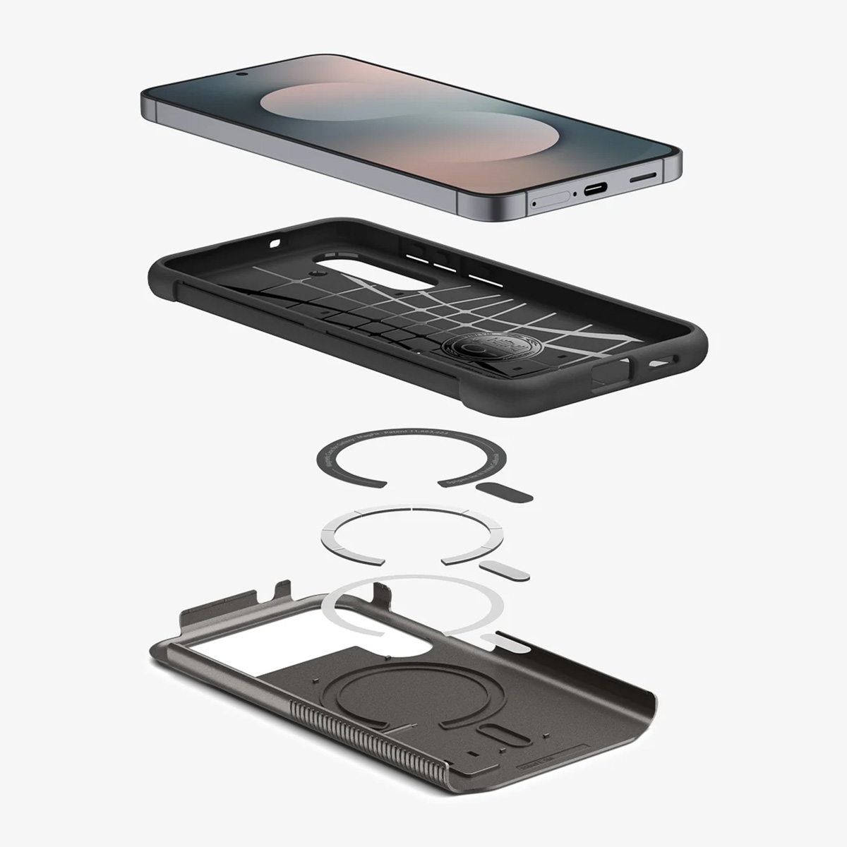 Exploded view van een telefoon en hoesonderdelen. Telefoon, zwarte hoes, magnetische ringen en grijze hoesbodem worden getoond.