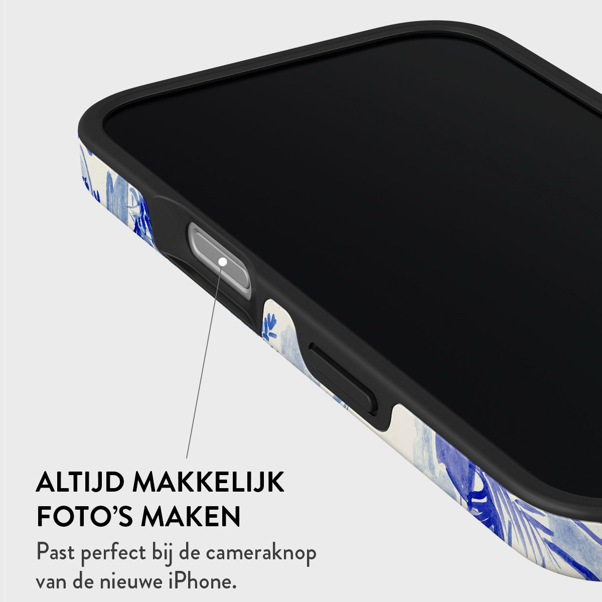 Gros plan d'un téléphone dans un étui avec des motifs floraux bleus. Le texte en bas dit : 'Toujours facile de prendre des photos' avec des informations sur le bouton de l'appareil photo.