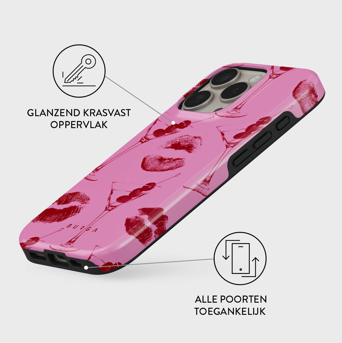 Een roze telefoonhoesje met rode lippenafdrukken en cocktailglazen. De hoes heeft een glanzende afwerking en is schuin.