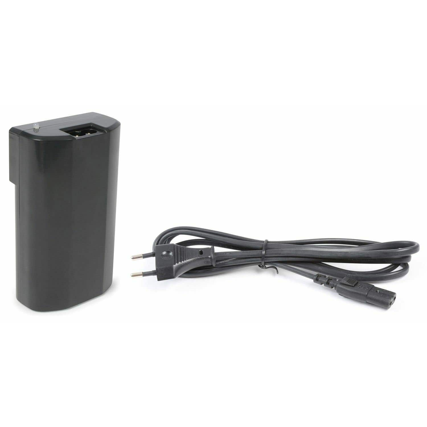 A black battery charger with a power cord lies on a white surface. The charger is on the left, the cord on the right.