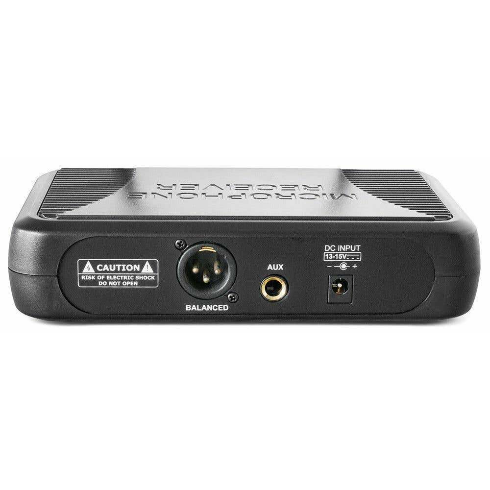 Black audio receiver with inputs labeled 'Balanced', 'AUX', and 'DC INPUT'. A caution label warns of electric shock.