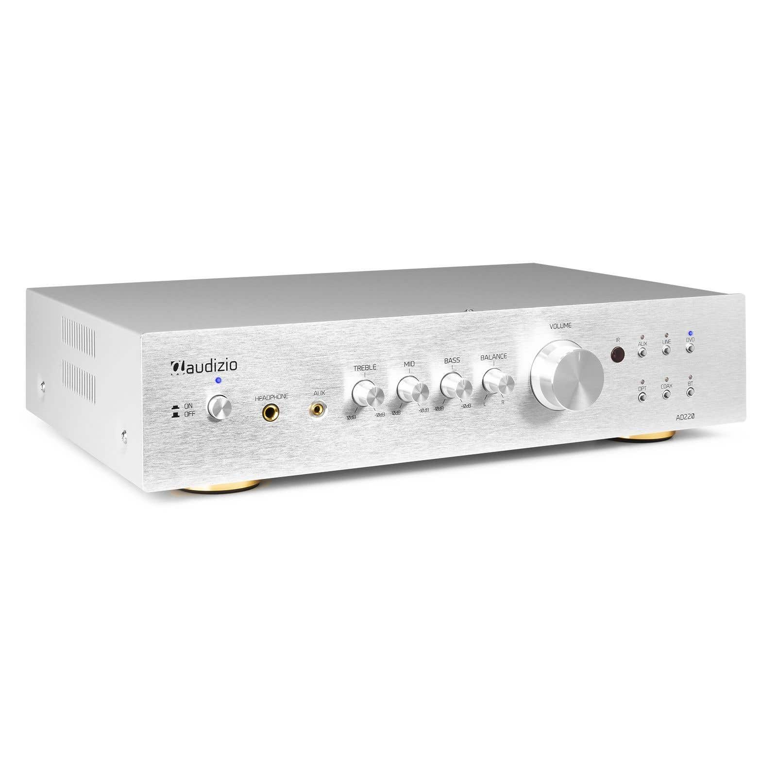 Amplificador de audio plateado con perillas, botones y puertos de entrada/salida. La marca es 'claudizio'.