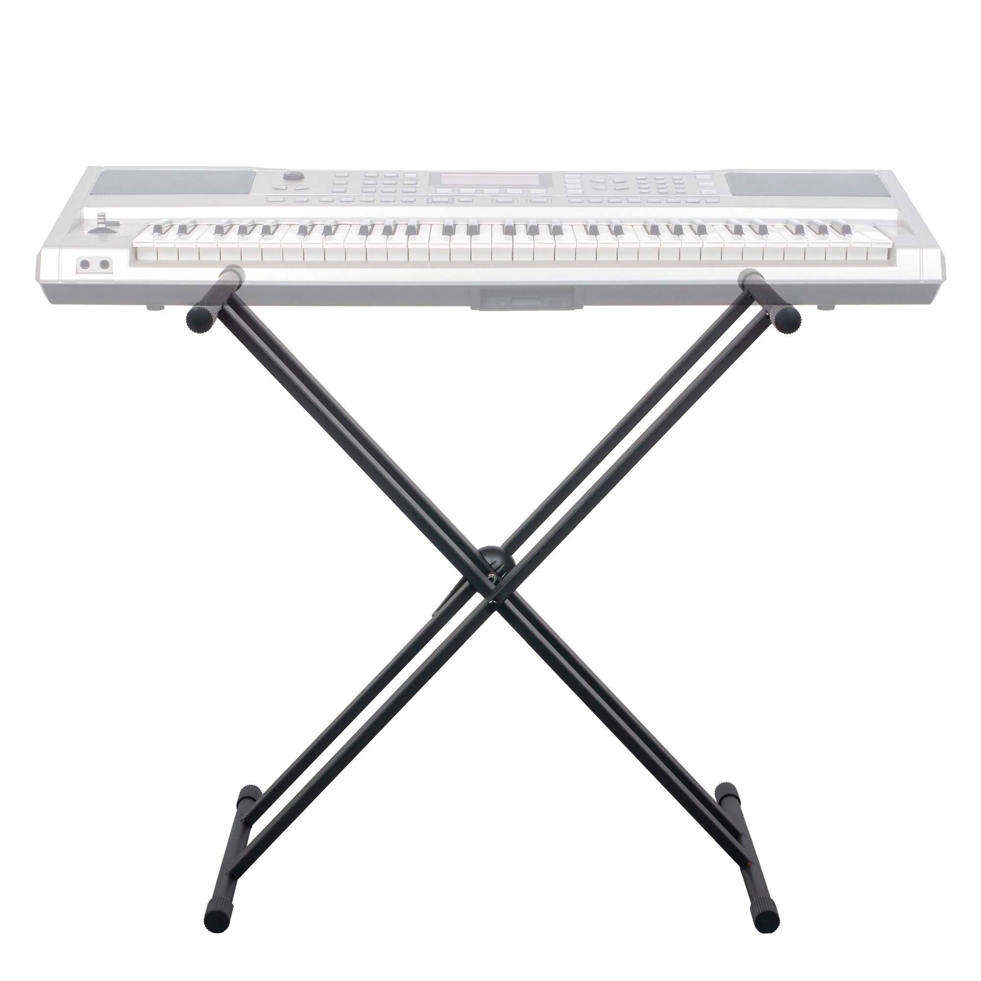 Un teclado blanco sobre un soporte negro en forma de X. El soporte tiene una estructura metálica. El fondo es blanco.