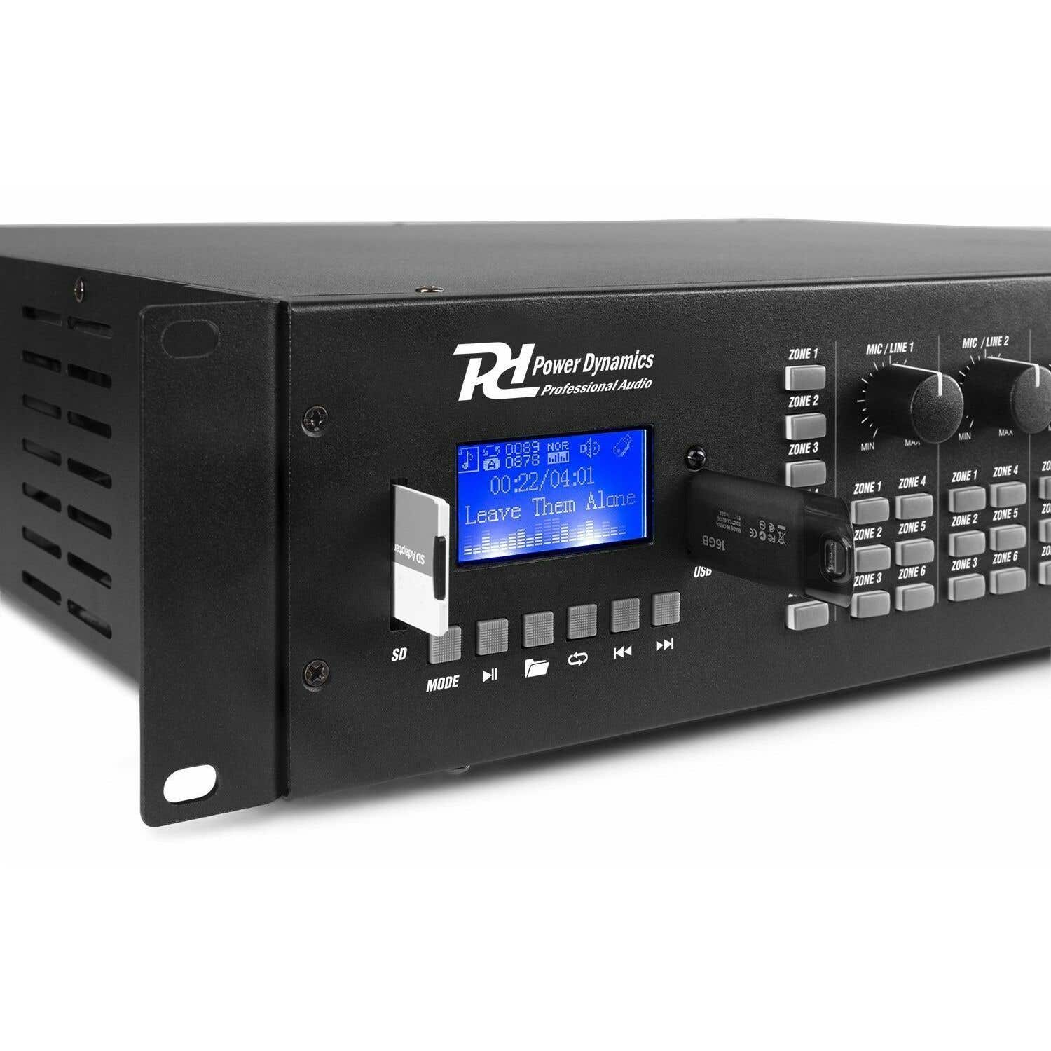 Schwarzes Audiogerät mit Bildschirm, der Songinformationen anzeigt. Verfügt über USB- und SD-Kartensteckplätze, Tasten und Knöpfe.