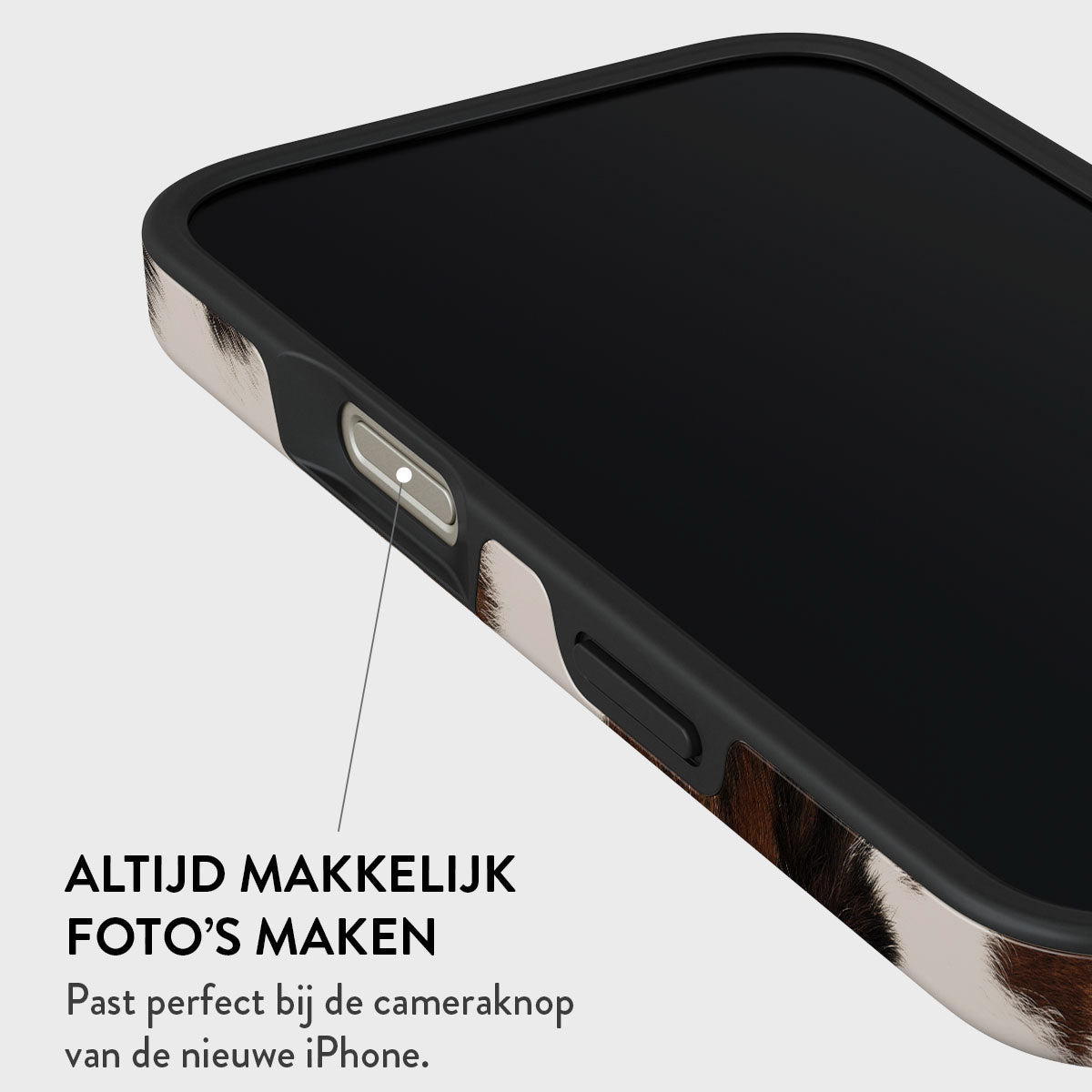 Gros plan d'un téléphone avec un étui à motifs. L'écran est noir. Texte en bas : 'Facile de prendre des photos'.