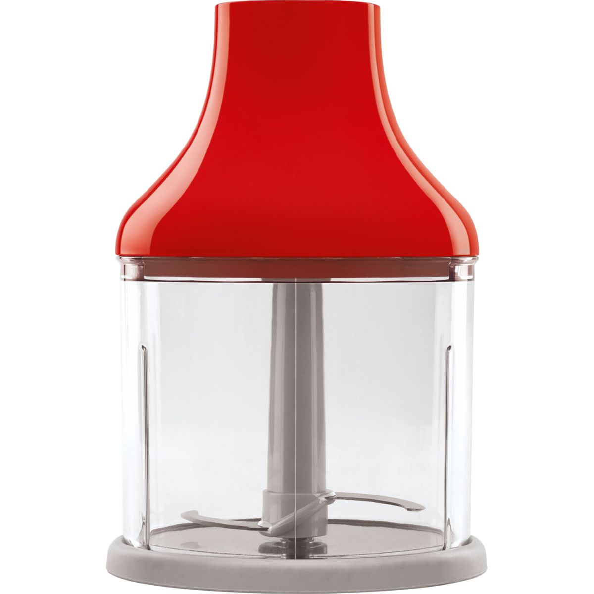 Czerwony i przezroczysty blender ręczny. Ma czerwoną górę i przezroczysty pojemnik. Ostrza są widoczne na dole.