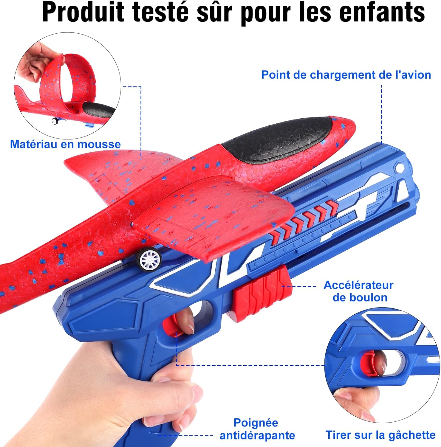 Ein rotes und schwarzes Schaumstoff-Spielzeugflugzeug wird von einer Hand gehalten. Das Flugzeug sitzt auf einer blauen Spielzeugpistole.