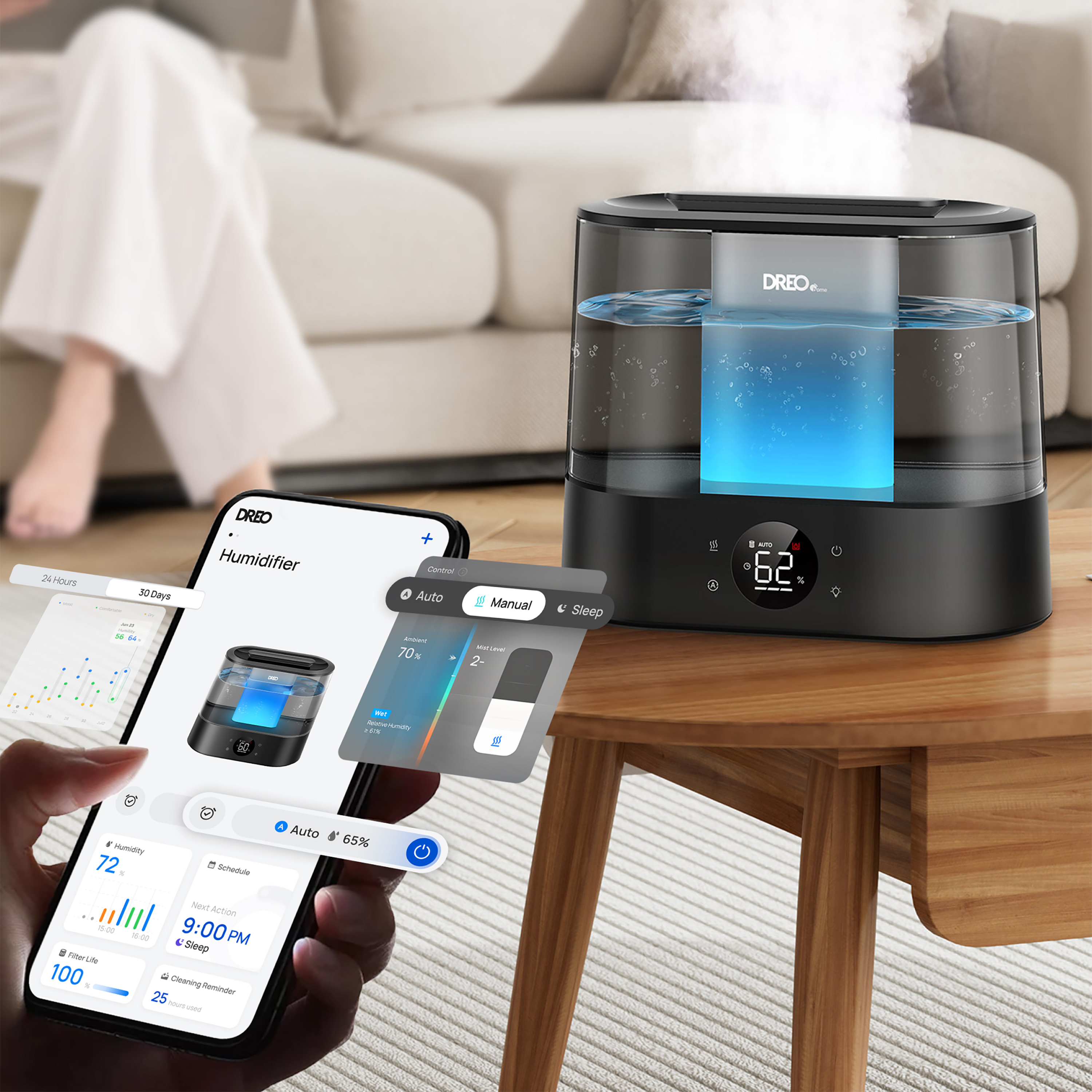 Un humidificador sobre una mesa de madera con un teléfono que muestra opciones de control y una persona con pantalones blancos al fondo.
