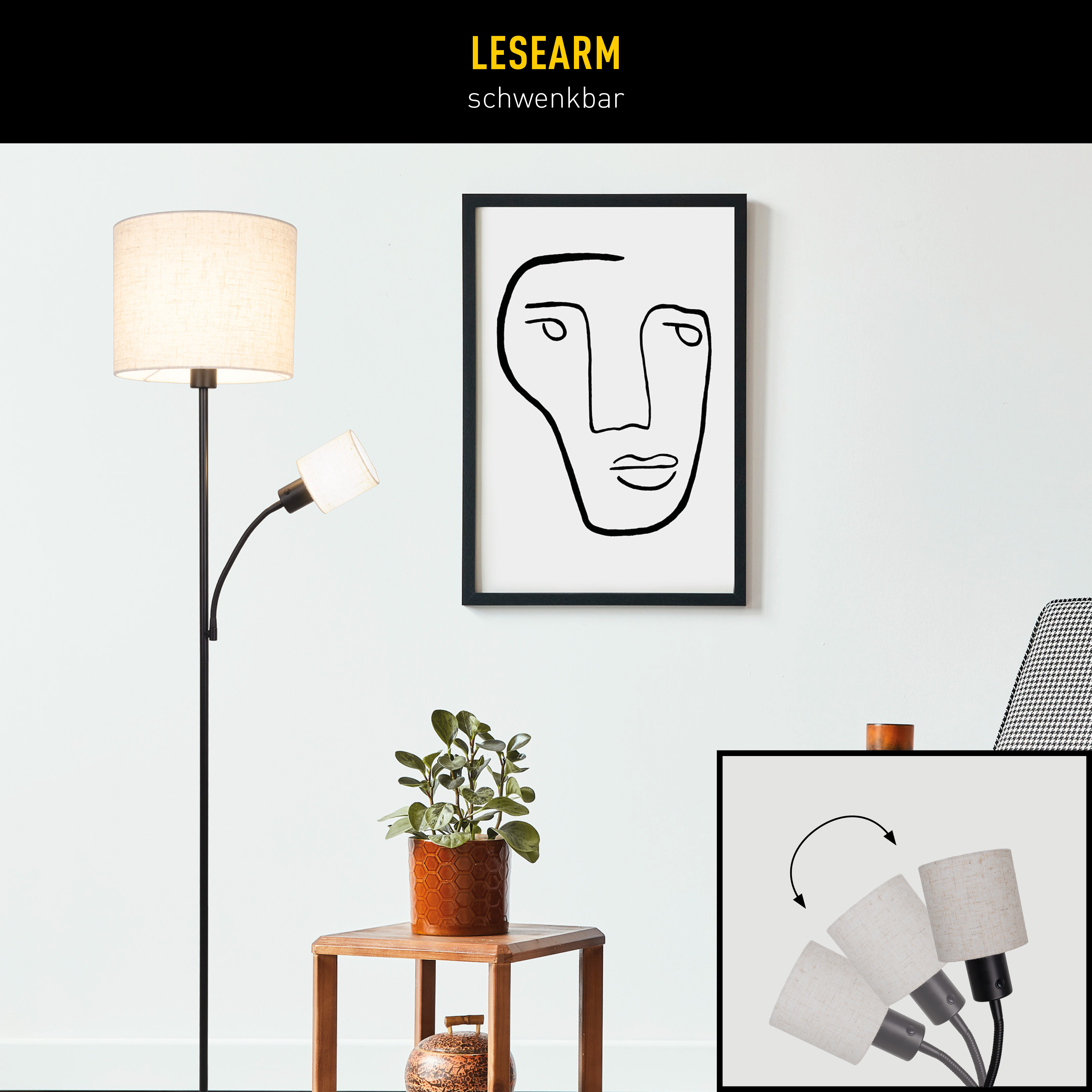 Eine Stehlampe mit zwei Lampenschirmen, eine Zeichnung eines Gesichts, eine Pflanze und ein kleiner Tisch.