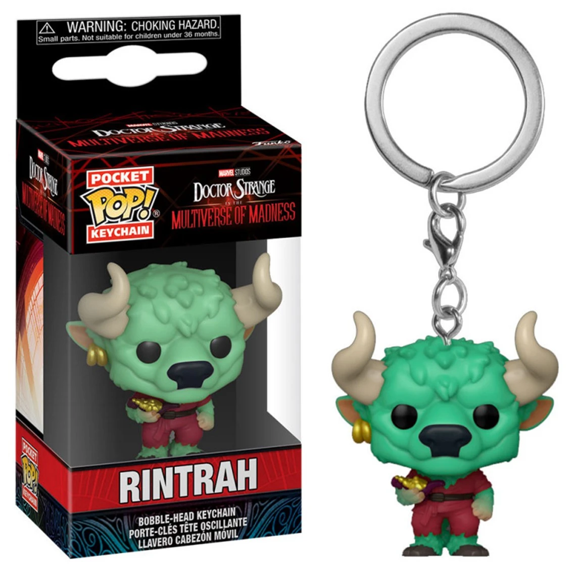 Un llavero de Rintrah de Doctor Strange: Multiverse of Madness. La figura verde con cuernos está a la derecha. Una caja está a la izquierda.