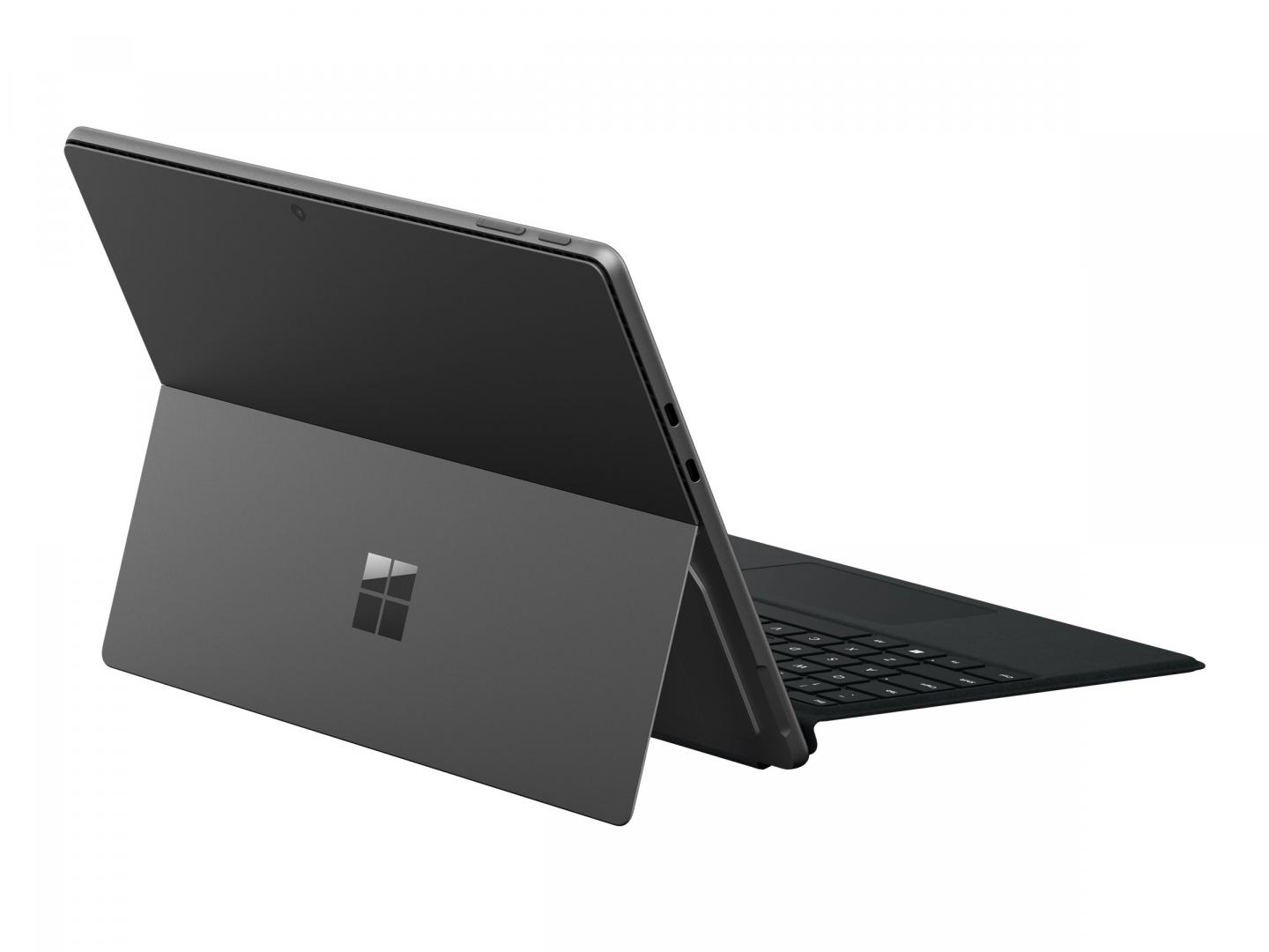 Ein graues Microsoft Surface Pro Tablet ist geöffnet. Der Bildschirm zeigt nach oben, und die Tastatur ist sichtbar. Das Microsoft-Logo ist auf der Rückseite.