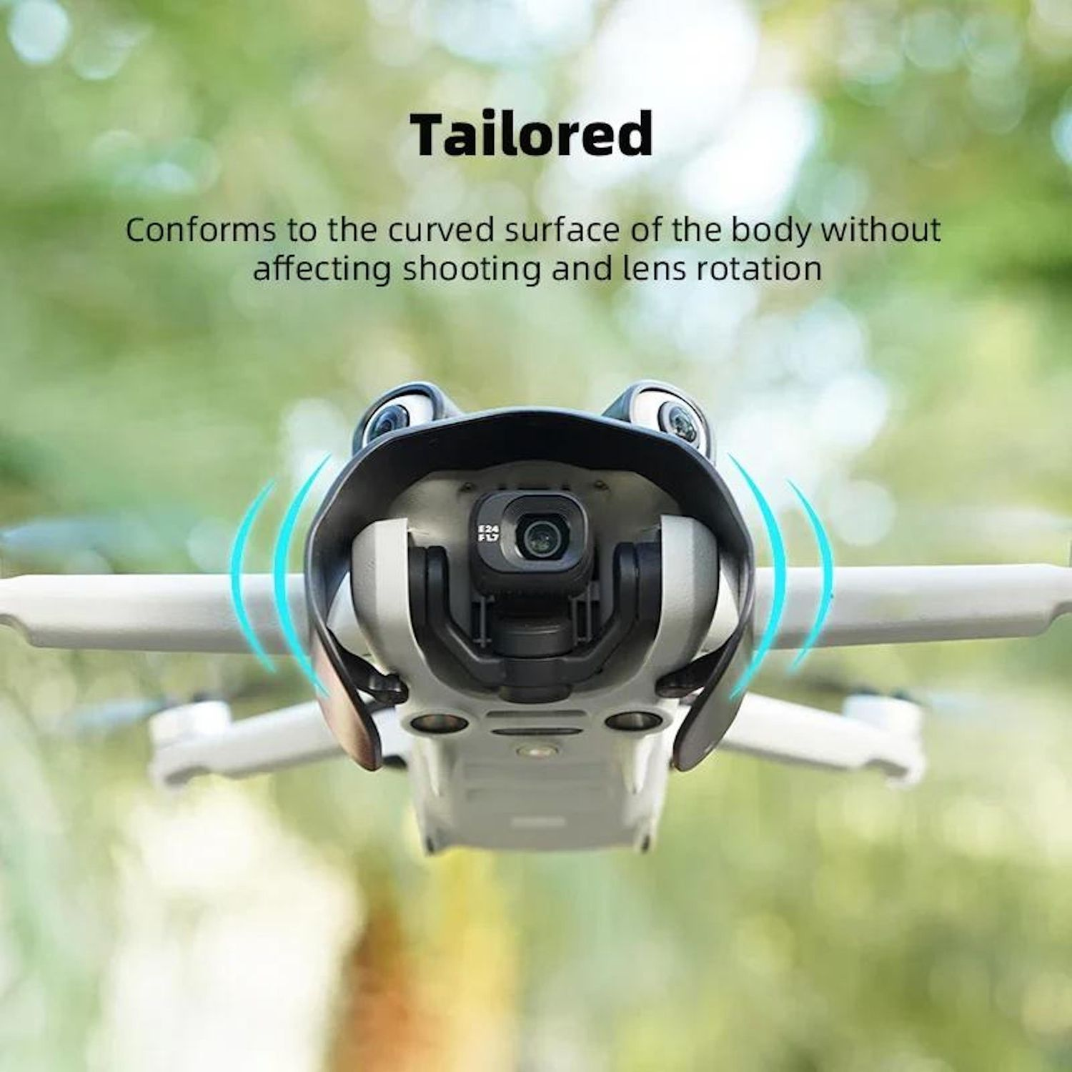 Un drone con copertura protettiva a fuoco. Lo sfondo è verde sfocato. Testo: 'Tailored' e 'Conforms...rotation'.