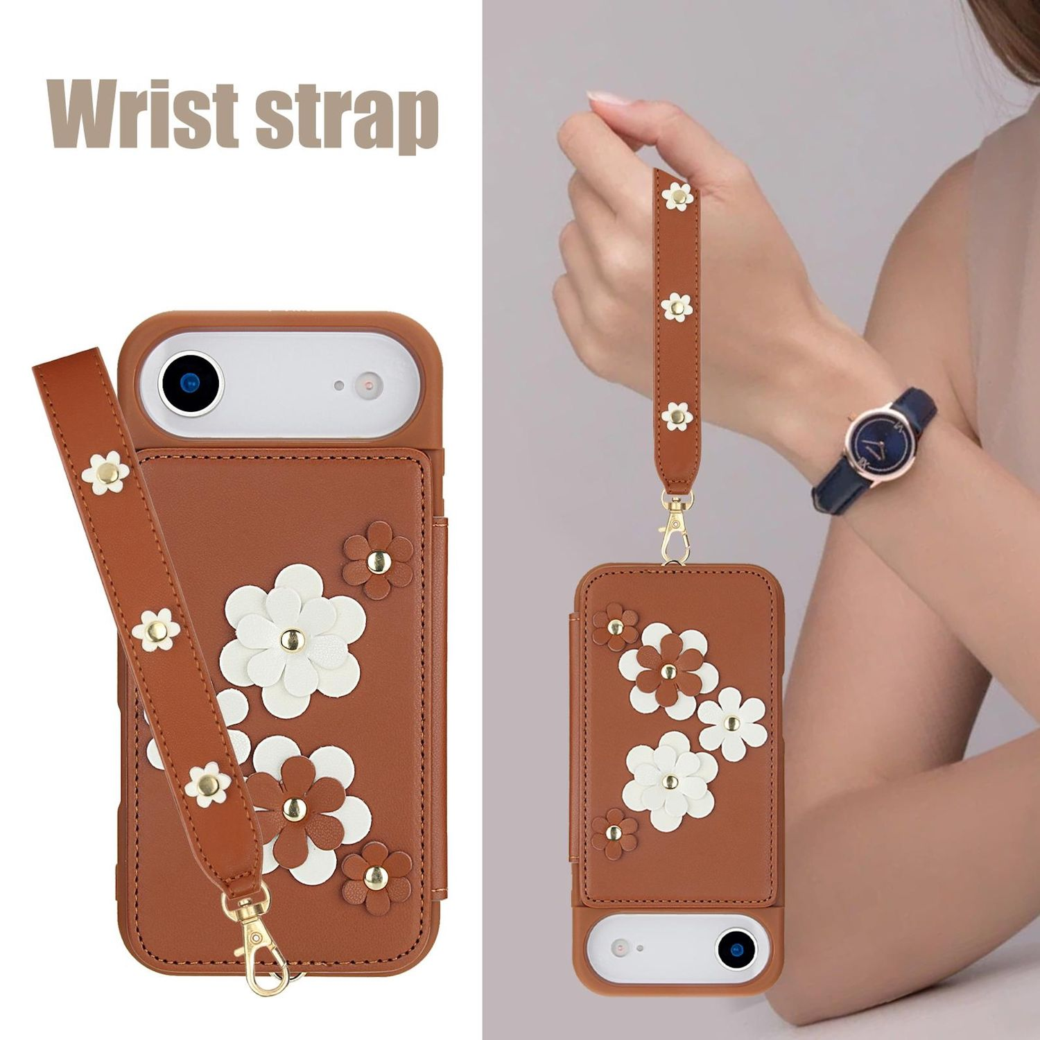 Una funda de teléfono marrón con correa de muñeca. La funda tiene adornos florales blancos y marrones. Una persona sostiene la correa, usando un reloj.