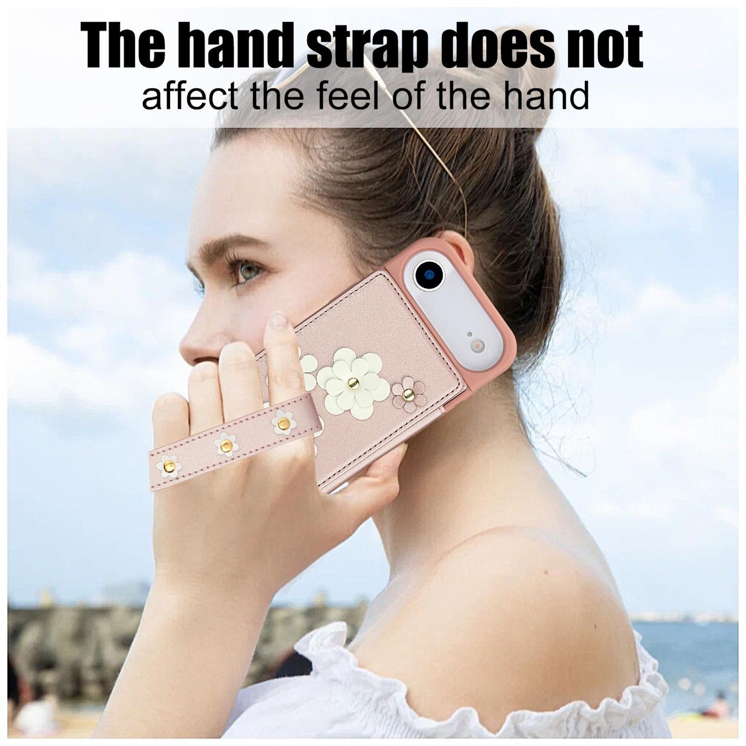 Una mujer sostiene una funda rosa para teléfono con una correa de mano. La funda tiene un diseño de flores. El texto dice: 'La correa de mano no afecta el tacto'.