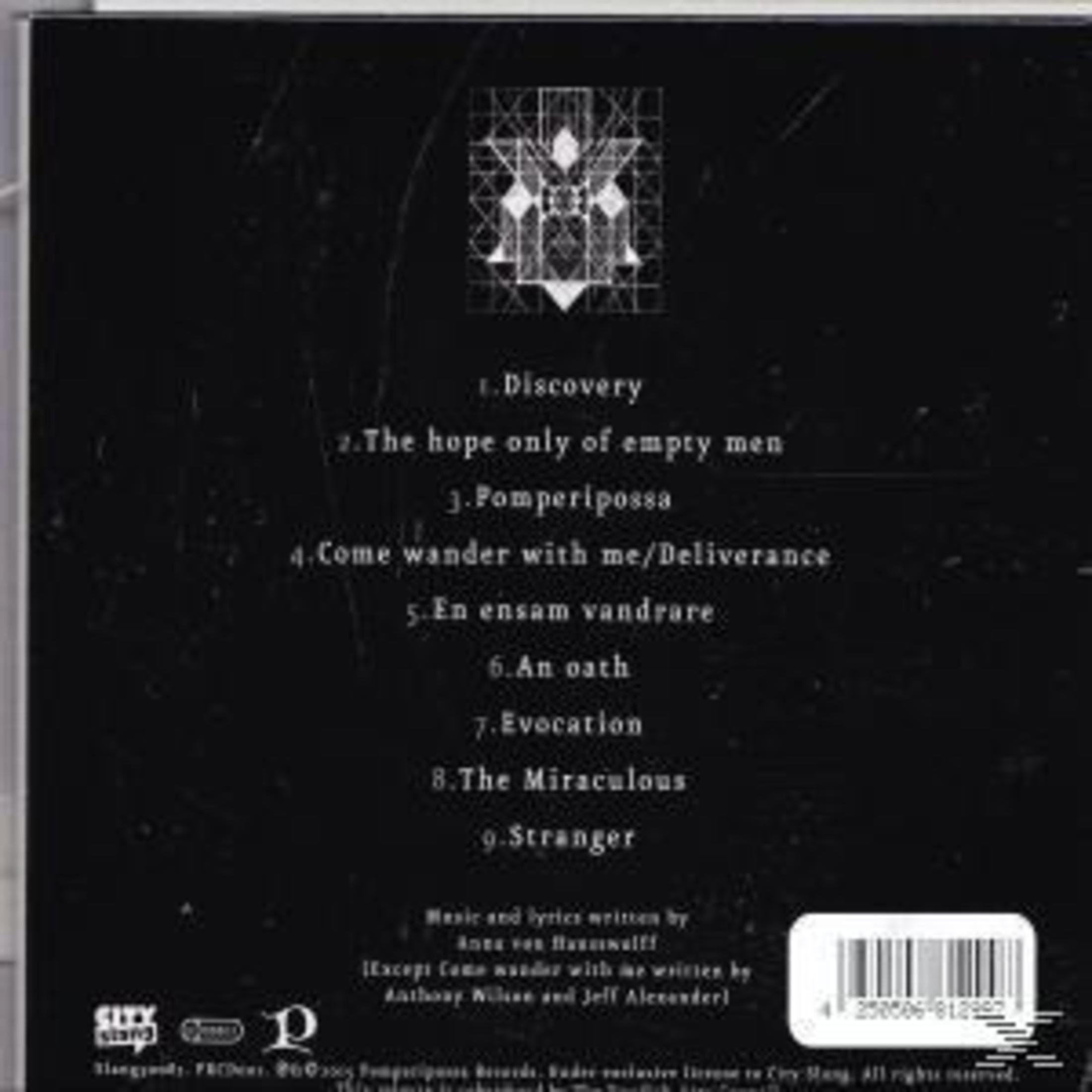 Schwarzes Albumcover mit weißem Text. Titel: Discovery. Songtitel aufgelistet. Unten rechts Barcode. Geometrische Kunst oben.
