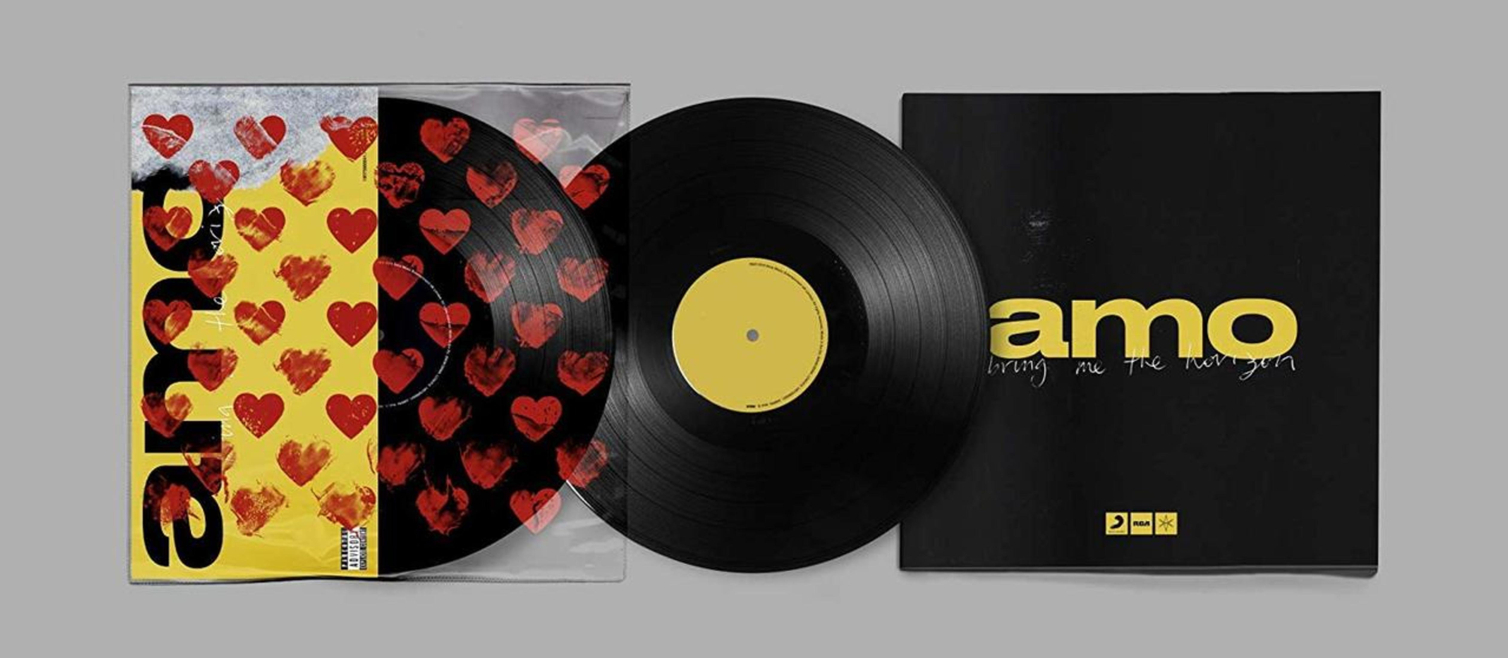 Vinyl-Schallplattenset. Eine Schallplatte ist sichtbar, der Rest ist in einer Hülle mit roten Herzen. Auf dem Cover steht 'amo' in Gelb.
