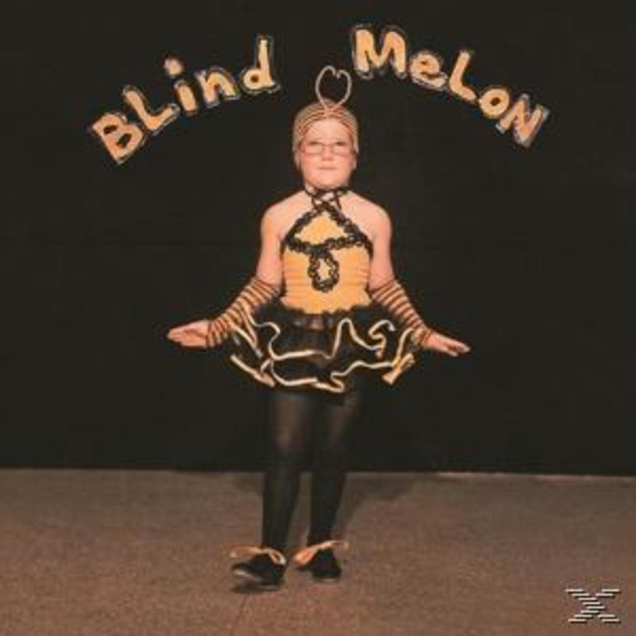 Ein Kind in einem Bienenkostüm steht vor einem schwarzen Hintergrund. Die Worte "Blind Melon" stehen über dem Kind.