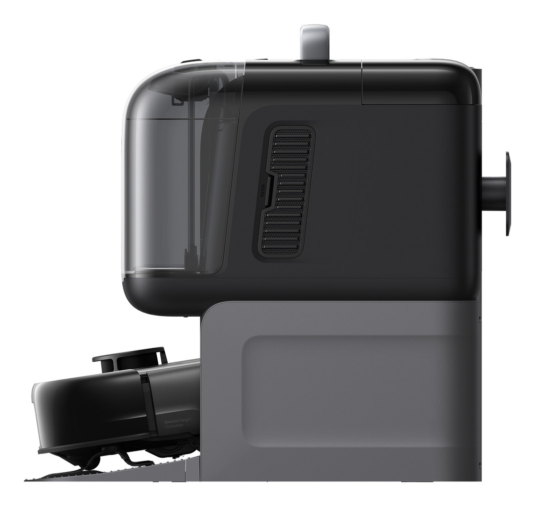 Widok z boku czarno-szarej podstawy odkurzacza robota z przezroczystym zbiornikiem na wodę i uchwytem na górze.