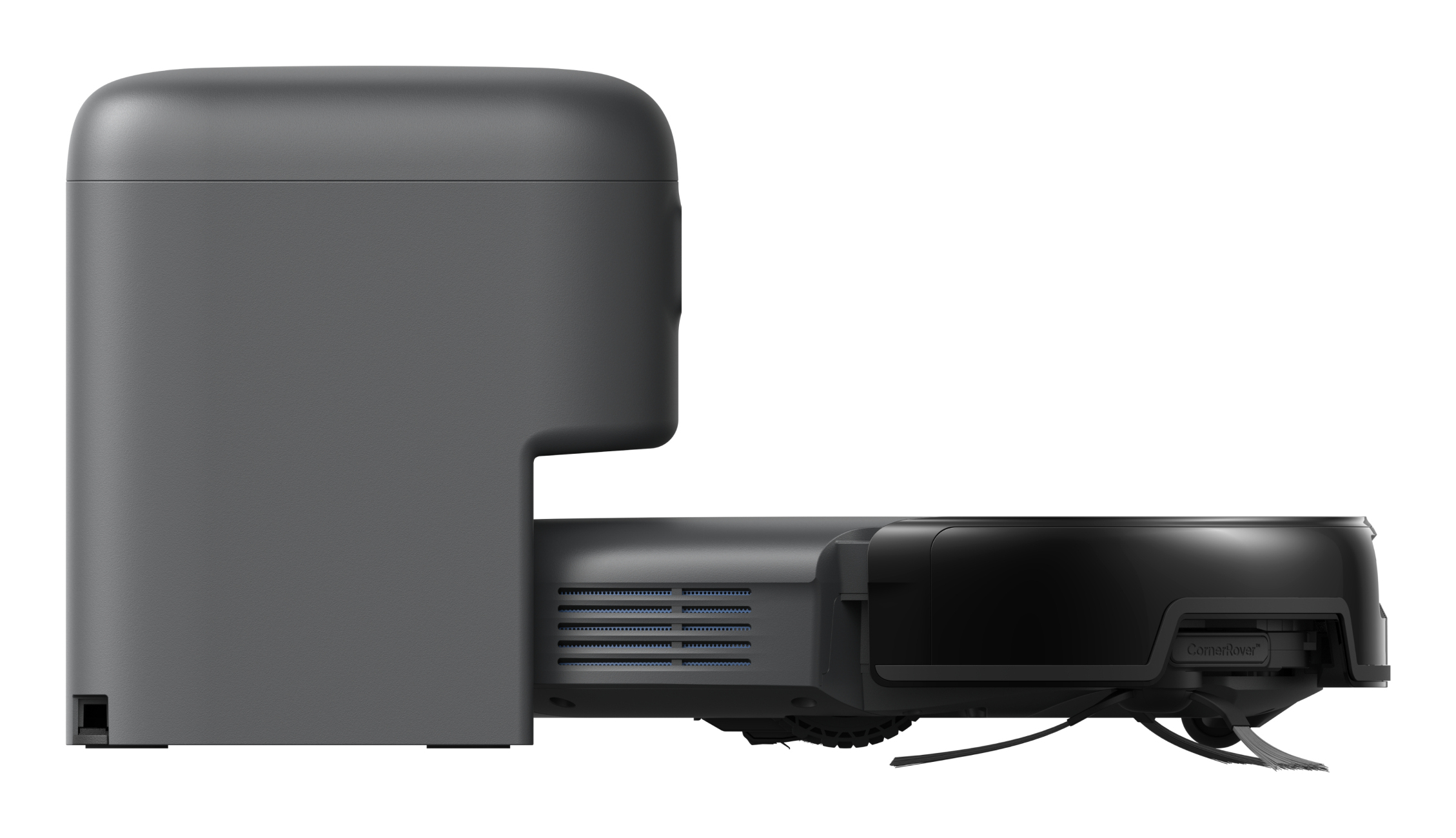 Widok z boku szarego i czarnego robota odkurzającego. Ma prostokątny korpus z zaokrąglonymi rogami i szczotkę czyszczącą.