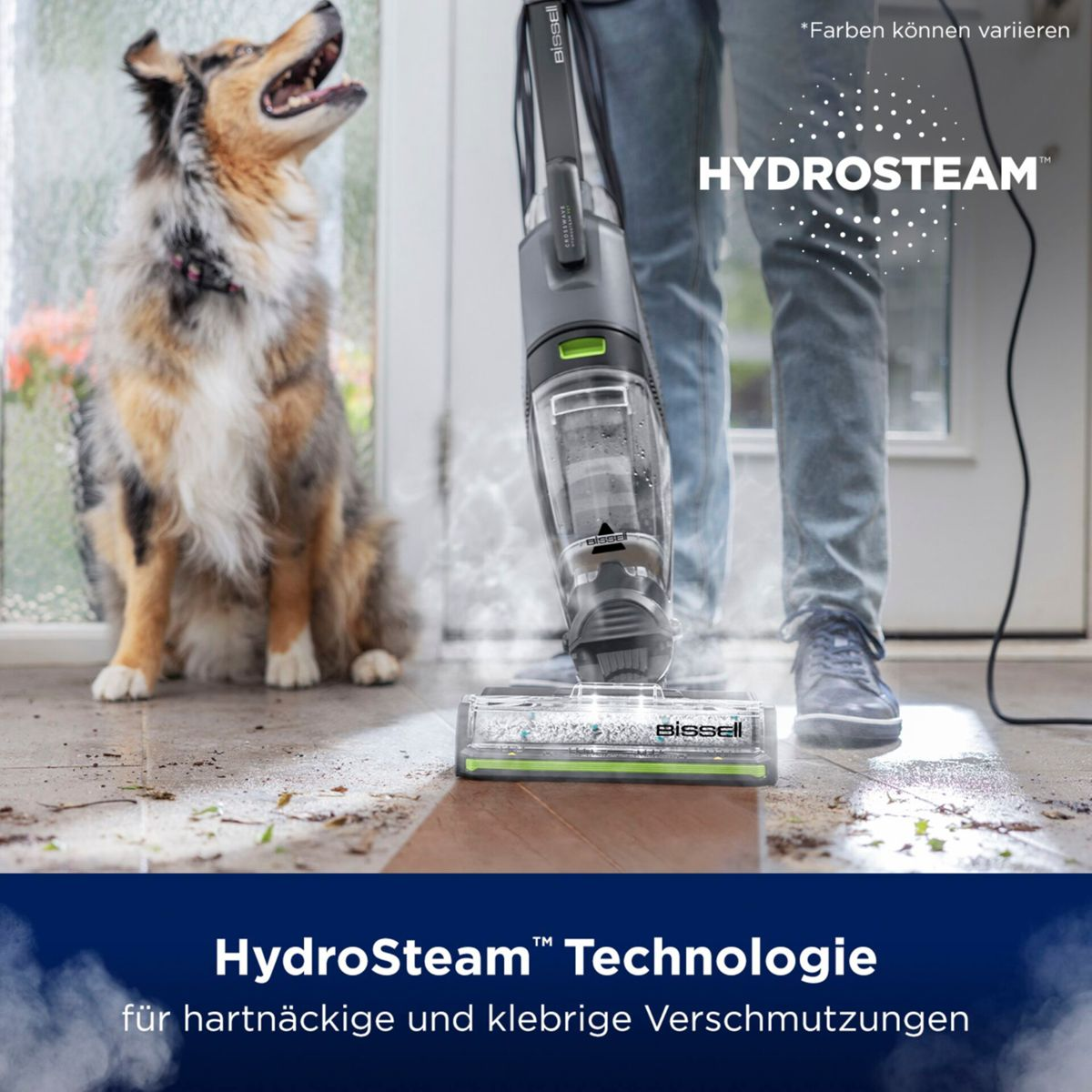Pies patrzy w górę, gdy osoba odkurza za pomocą odkurzacza HydroSteam. Podłoga jest częściowo czysta. Tekst: HydroSteam Technologie.