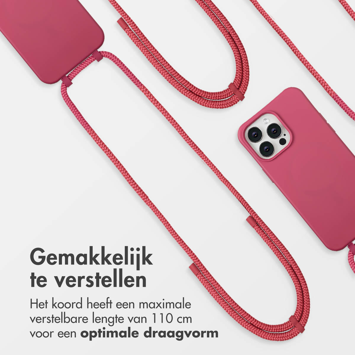 Un étui de téléphone rose avec une sangle, sur une surface blanche. La sangle est rouge. Le texte néerlandais dit 'Facile à régler'.