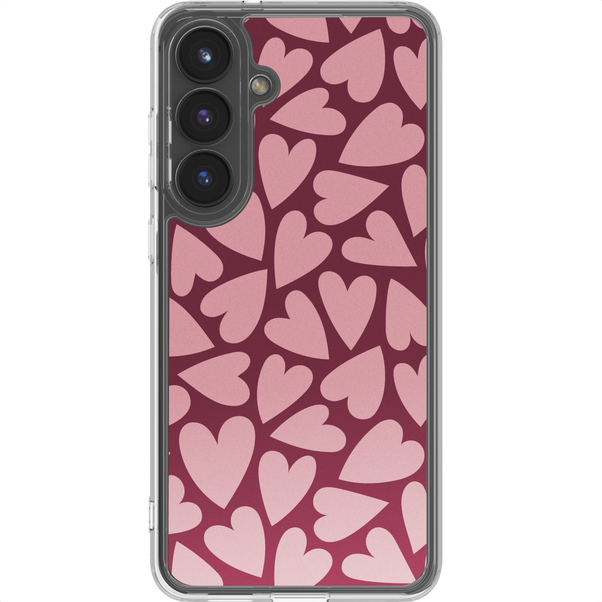 Een telefoon met een transparante hoes. De achtergrond heeft roze harten op een donkerrode achtergrond. De telefoon heeft drie camera's.