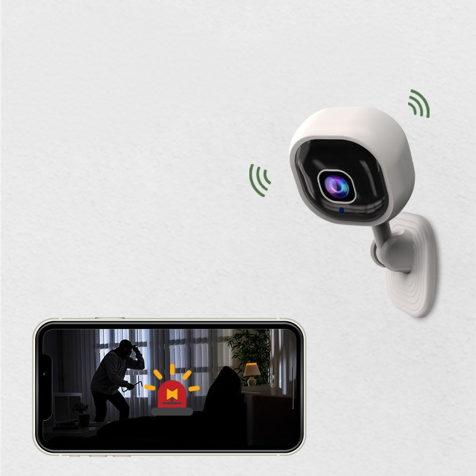 Eine Überwachungskamera an der Wand. Ein Telefon zeigt einen Einbrecher. Alarm-Symbol auf dem Bildschirm.
