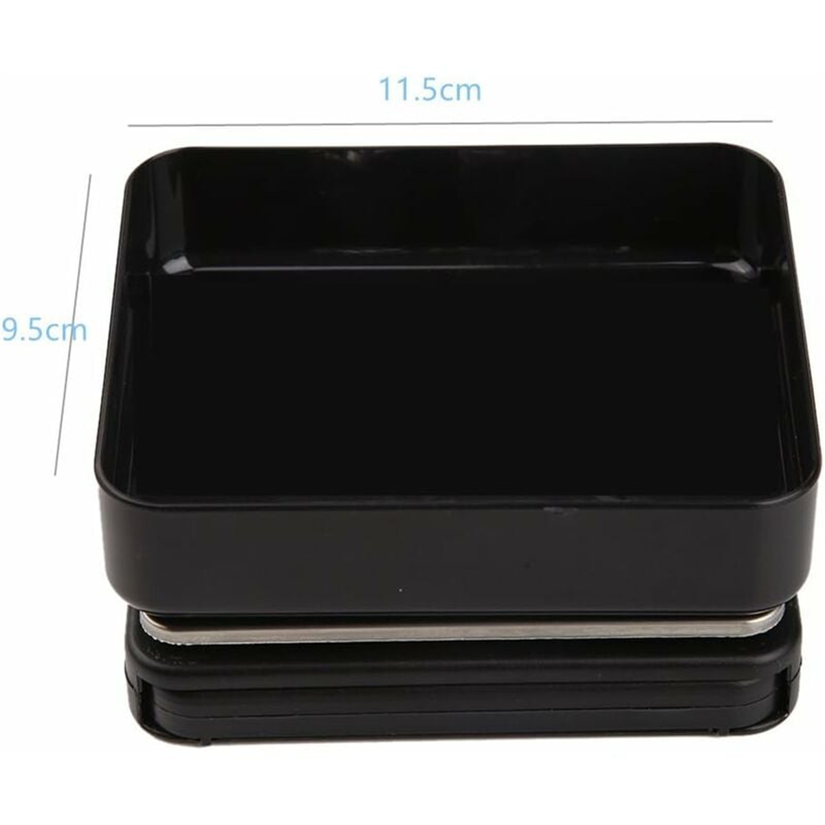 Ein schwarzes rechteckiges Objekt, möglicherweise eine Waage. Die Abmessungen sind angegeben: 11,5 cm breit und 9,5 cm hoch. Die Waage hat mehrere Schichten.