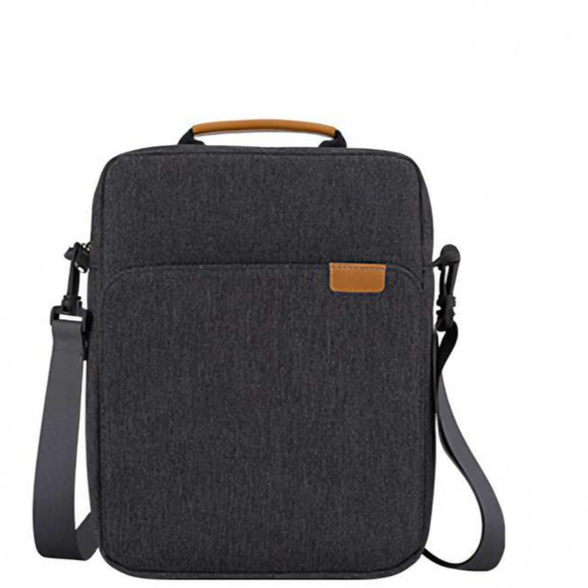 Eine dunkelgraue Umhängetasche mit braunem Griff und Riemen. Sie hat eine Vordertasche mit braunem Etikett.