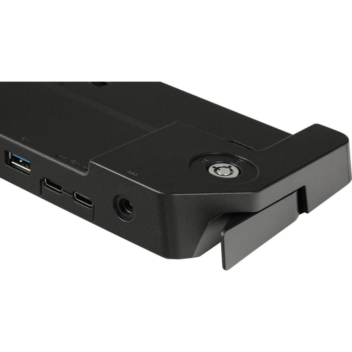 Primo piano di una docking station nera con porte USB, jack audio e serratura. Presenta un design rettangolare e una leva.