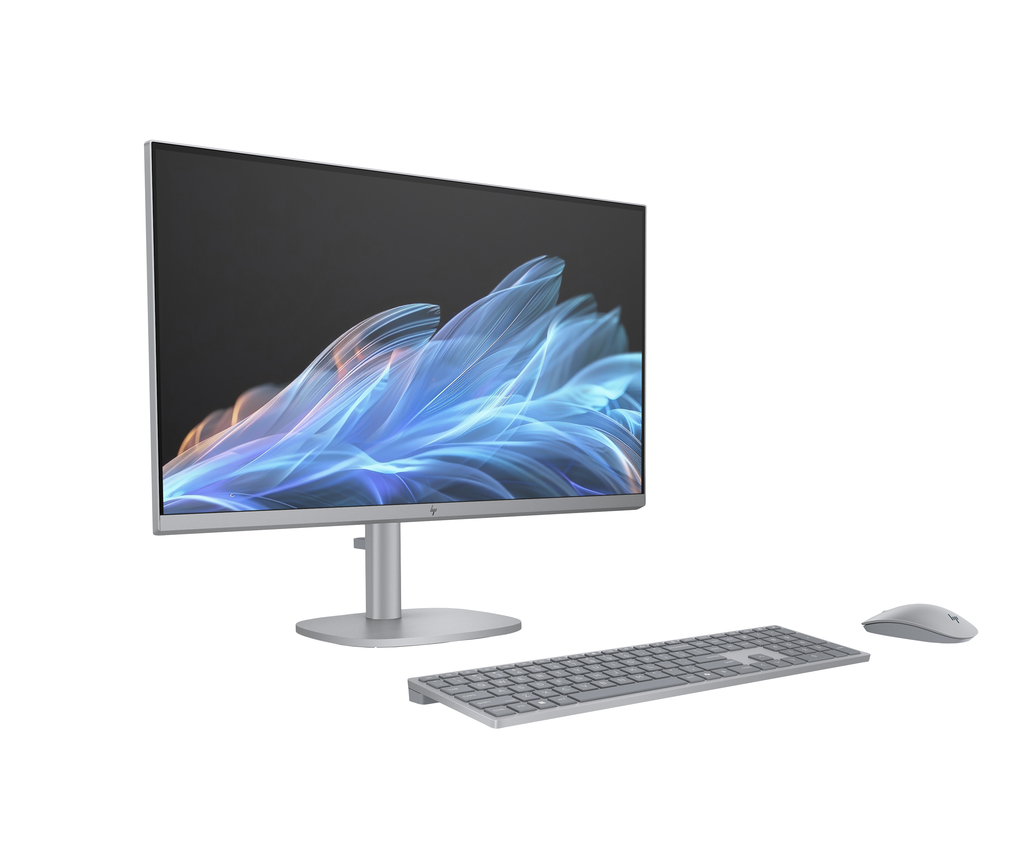 Srebrny monitor komputerowy, klawiatura i mysz na białej powierzchni. Monitor wyświetla niebieski i biały abstrakcyjny wzór.