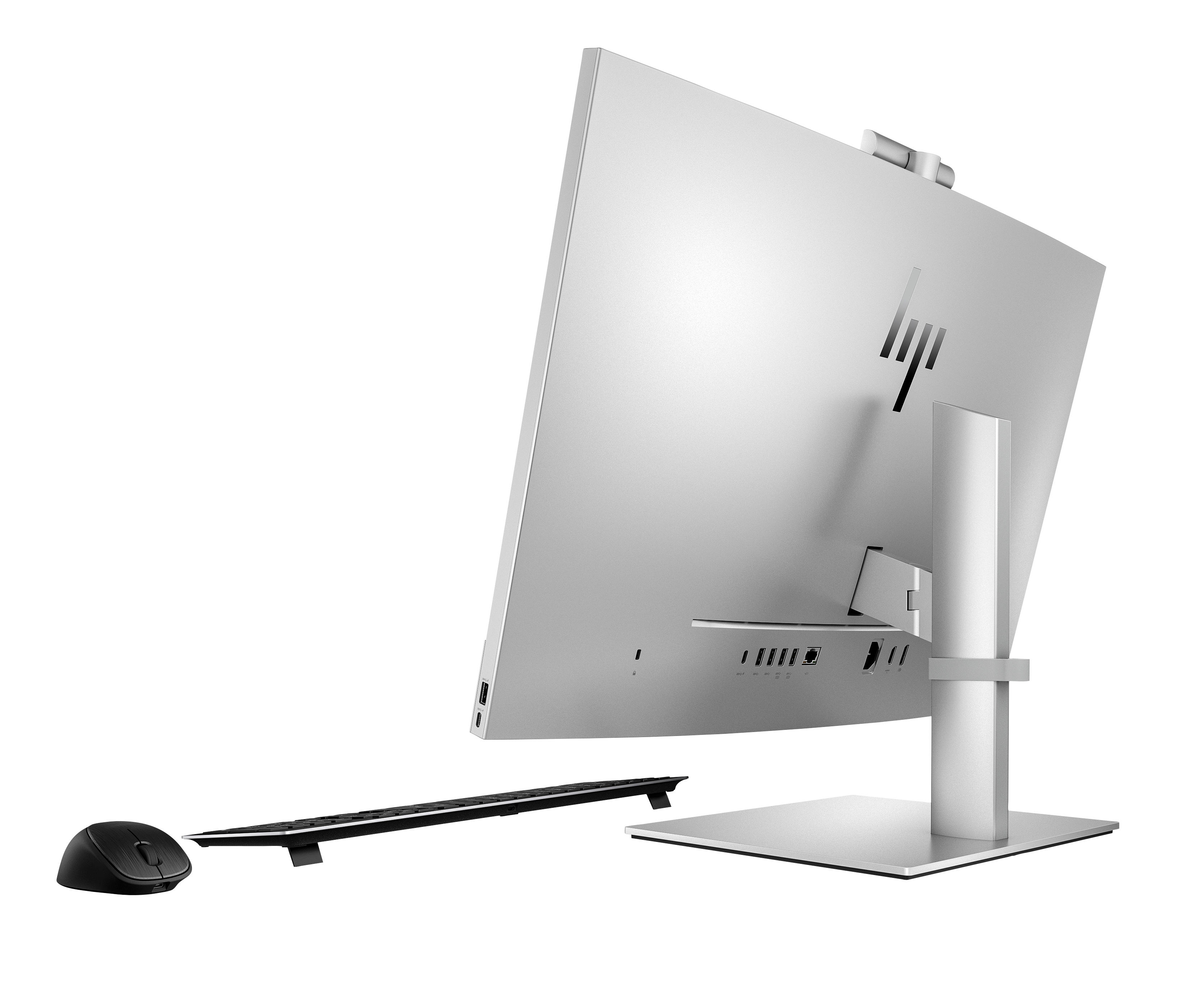 Un computer HP all-in-one argentato con tastiera e mouse neri. Il computer è su sfondo bianco.