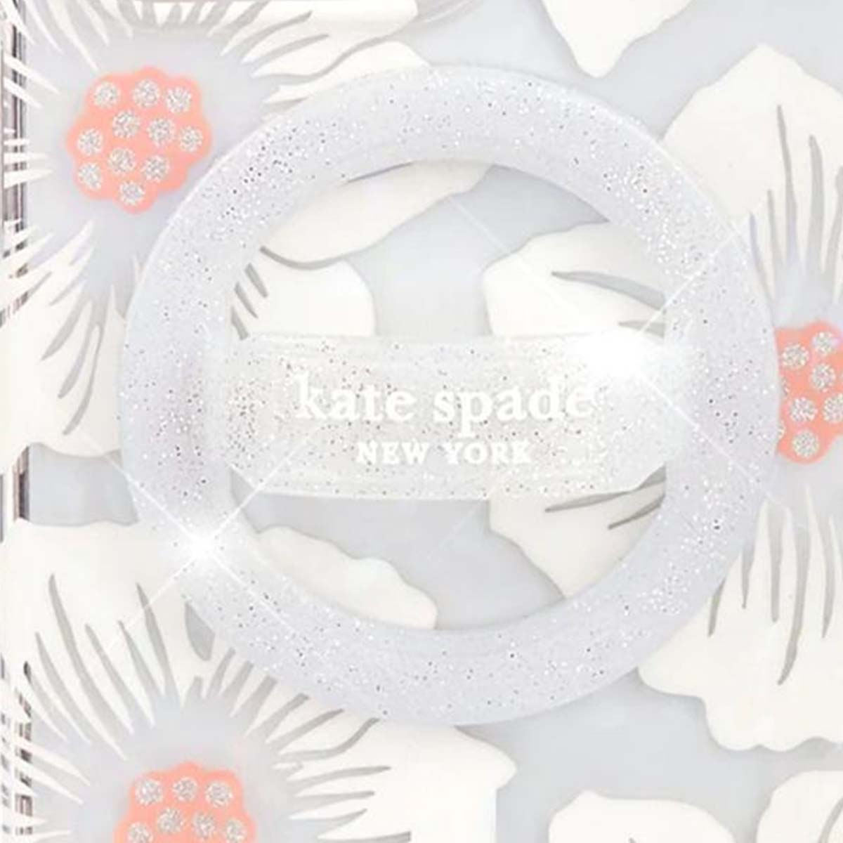 Una custodia per telefono Kate Spade con un design floreale bianco, una cornice scintillante e il nome del marchio.