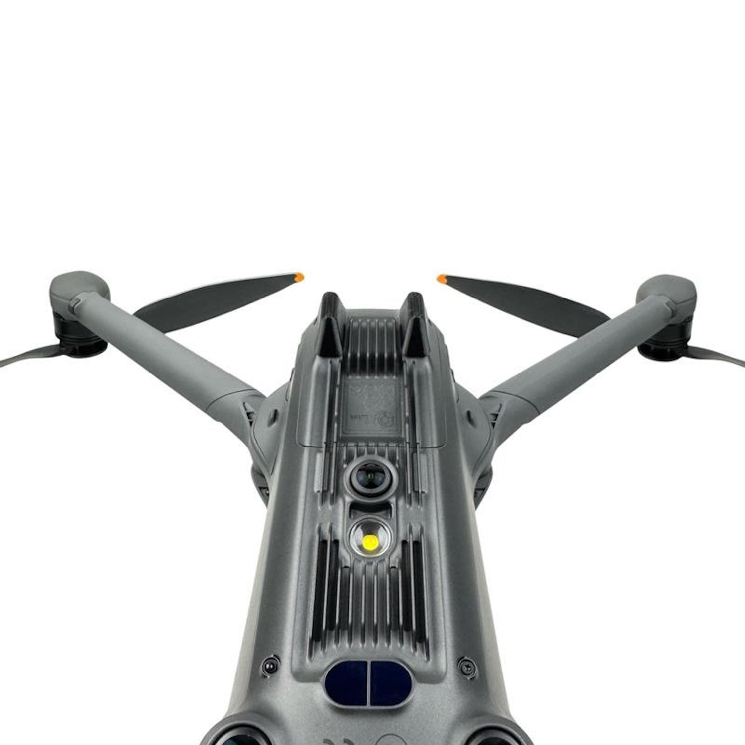 Un drone grigio è centrato, con eliche nere e punte arancioni. Ha un corpo cilindrico con luci. Lo sfondo è bianco.