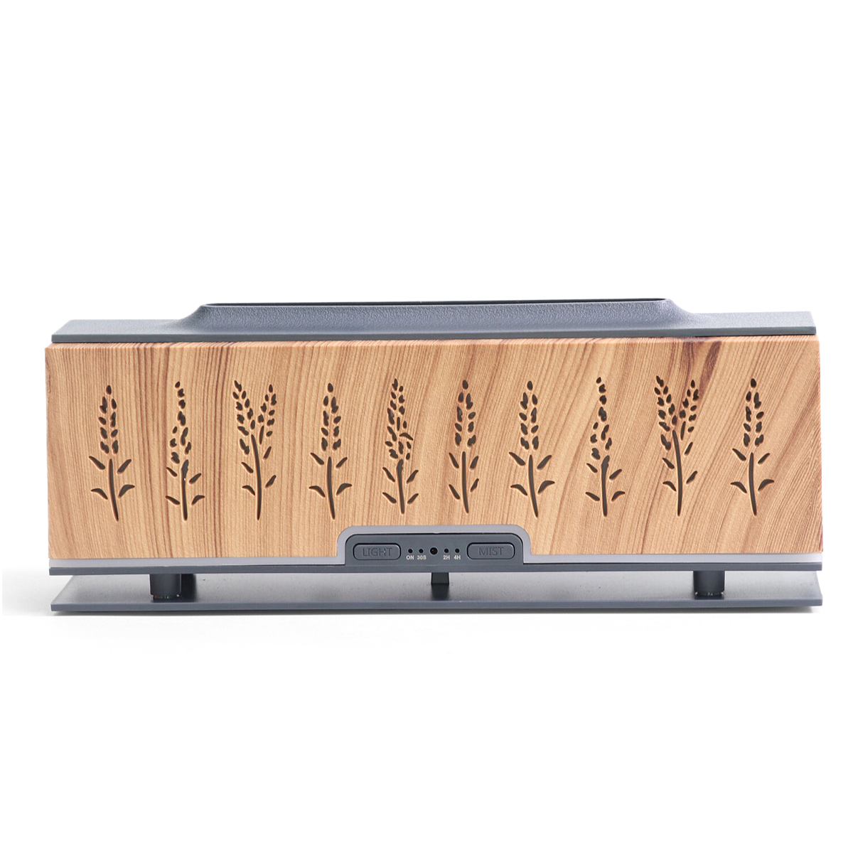 Ein holzartig aussehender Aromatherapie-Diffusor mit floralen Ausschnitten. Er hat Licht- und Nebeltasten und steht auf einer grauen Basis vor weißem Hintergrund.