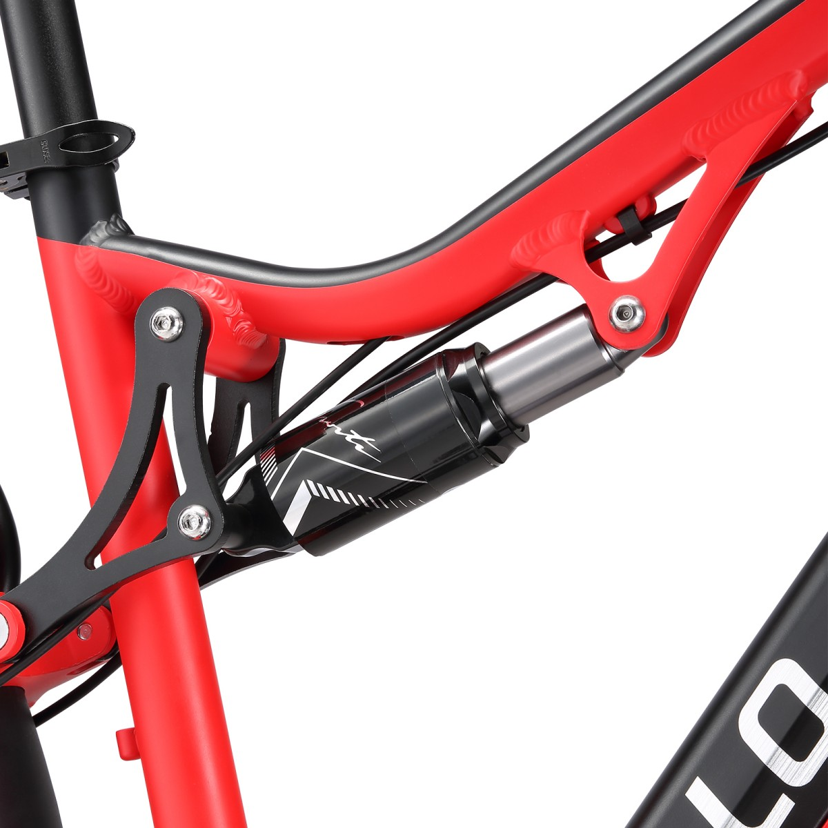 Zbliżenie czerwono-czarnej ramy roweru górskiego. Rama posiada amortyzator i różne elementy mechaniczne.