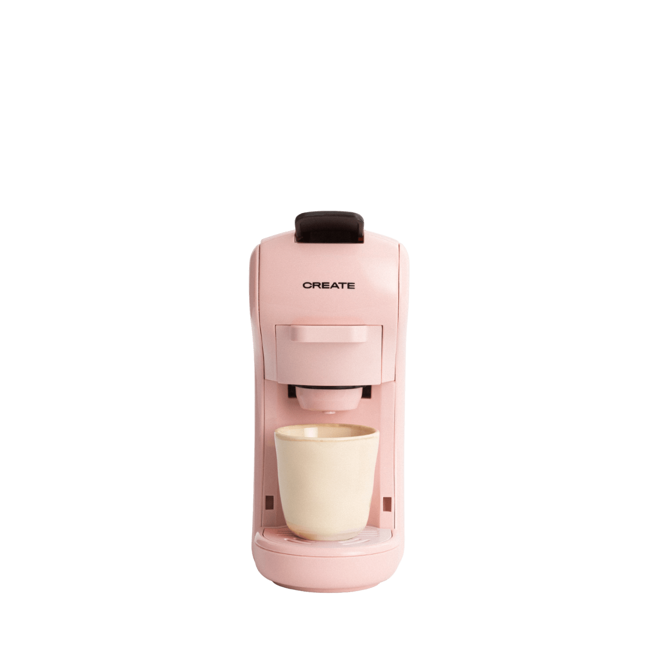 Una cafetera rosa con una taza crema sobre un fondo verde. La palabra 'CREATE' está impresa en la máquina.