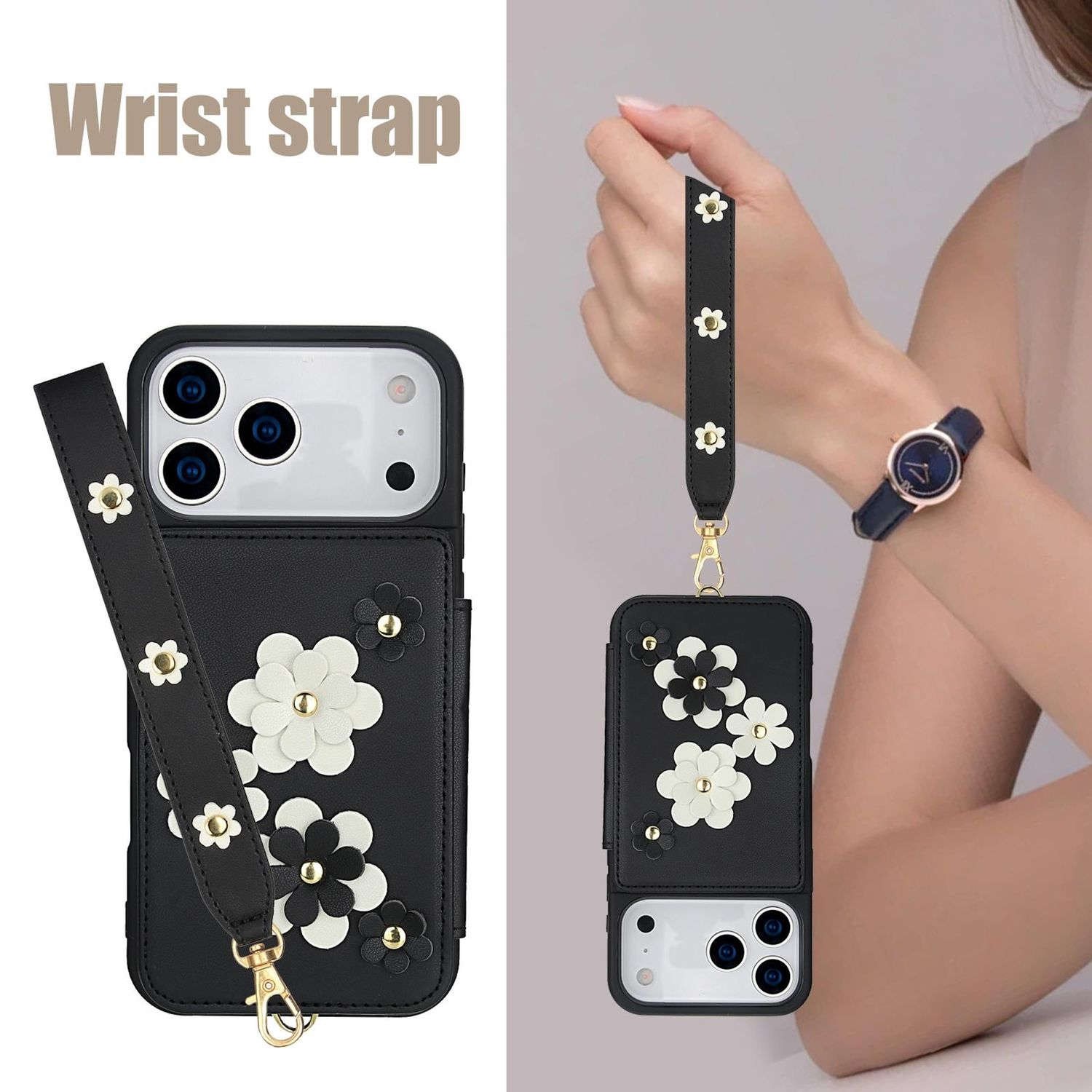 Schwarze Handyhülle mit weißen und schwarzen Blumenakzenten, einer Handschlaufe und einem goldenen Verschluss. Eine Frau hält die Schlaufe und trägt eine Uhr.