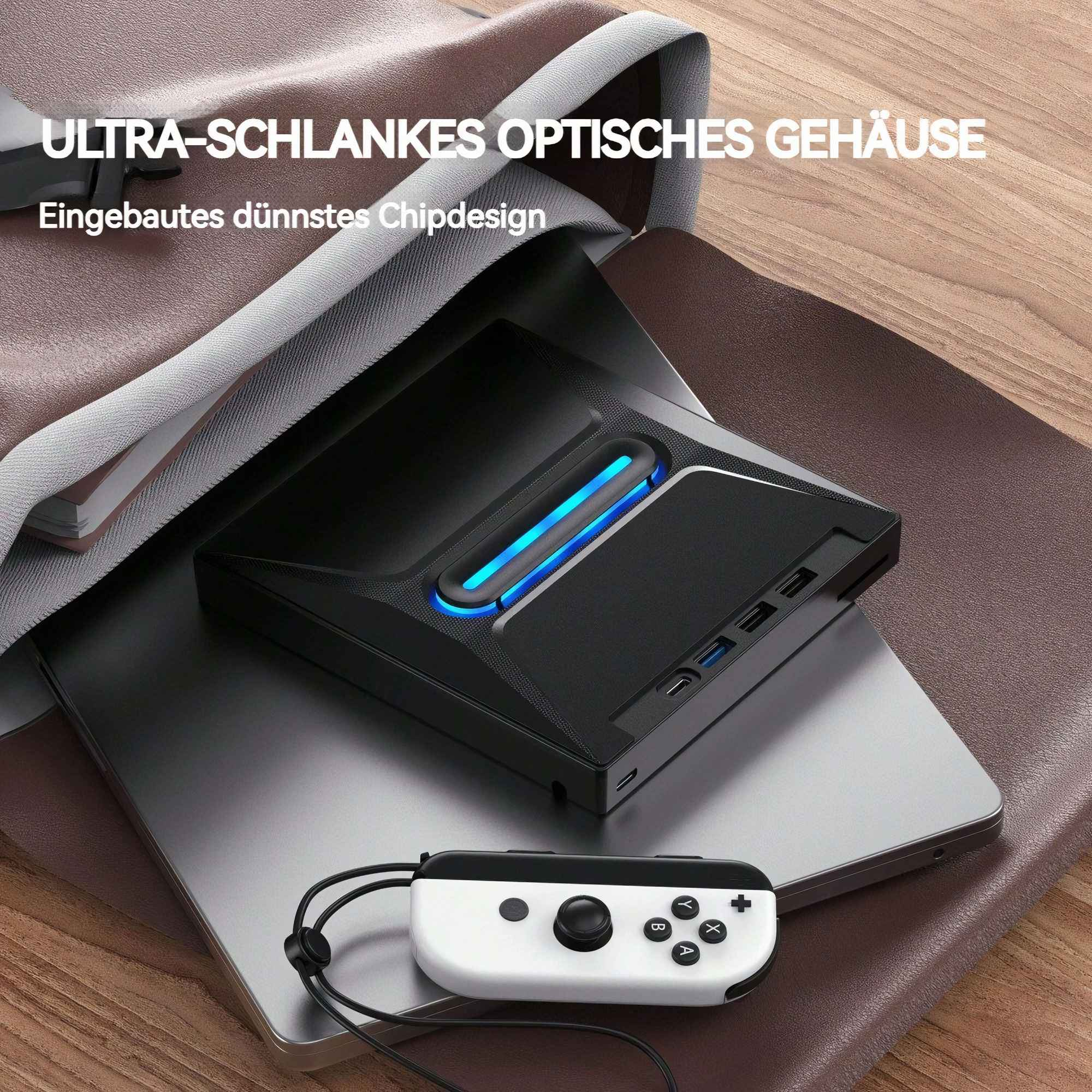 Ein schwarzes Gerät mit blauen Lichtern auf einem Laptop, mit einem weißen Controller. Auf brauner Oberfläche. Text lautet 'Ultra-schlankes optisches Gehäuse'.