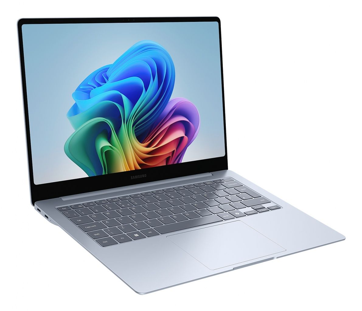 Pokazano otwarty laptop Samsung. Ekran wyświetla kolorowy, abstrakcyjny wzór. Klawiatura i touchpad są widoczne.