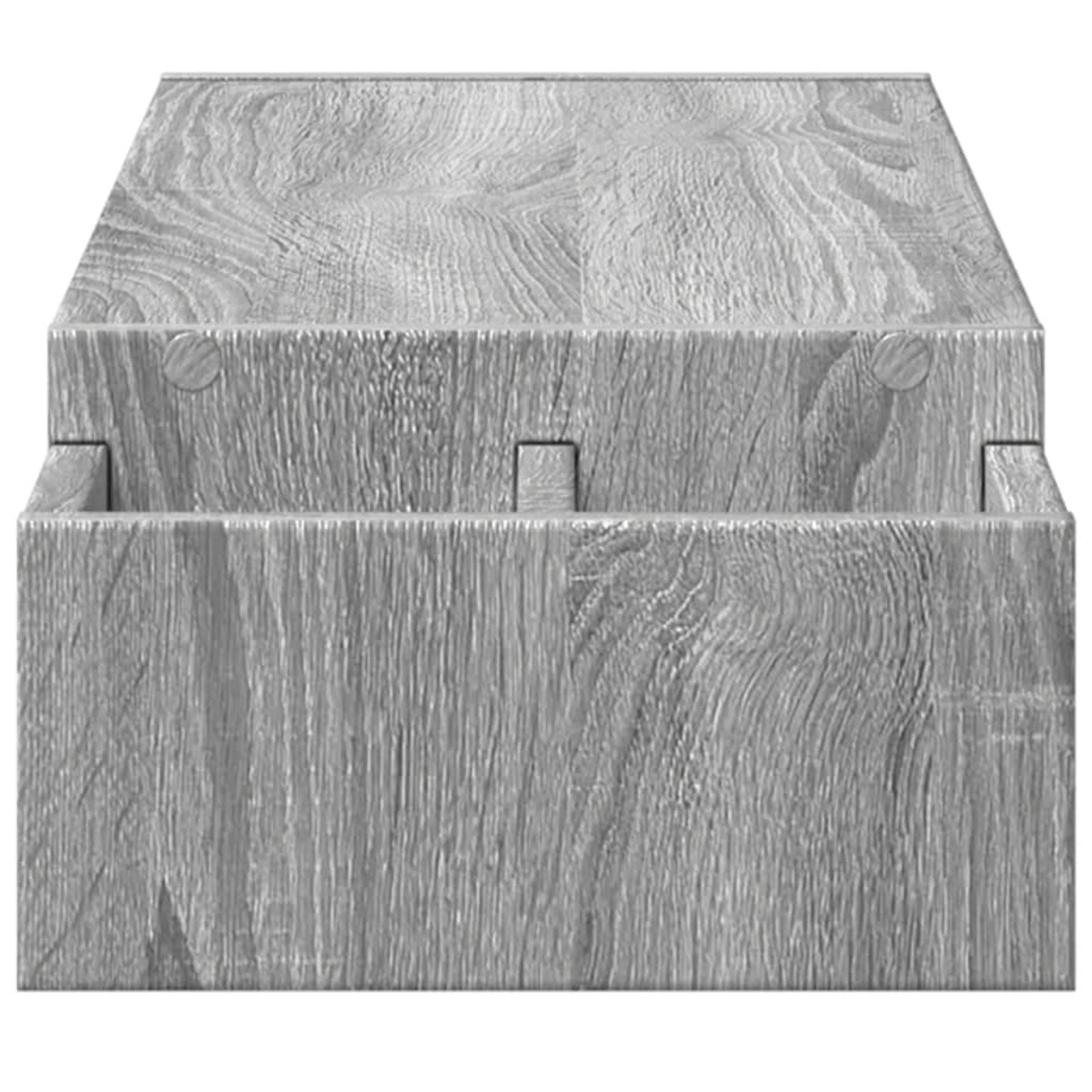 Eine graue Holzkiste mit Deckel. Die Kiste hat sichtbare Holzmaserung und ist aus ineinandergreifenden Teilen aufgebaut.